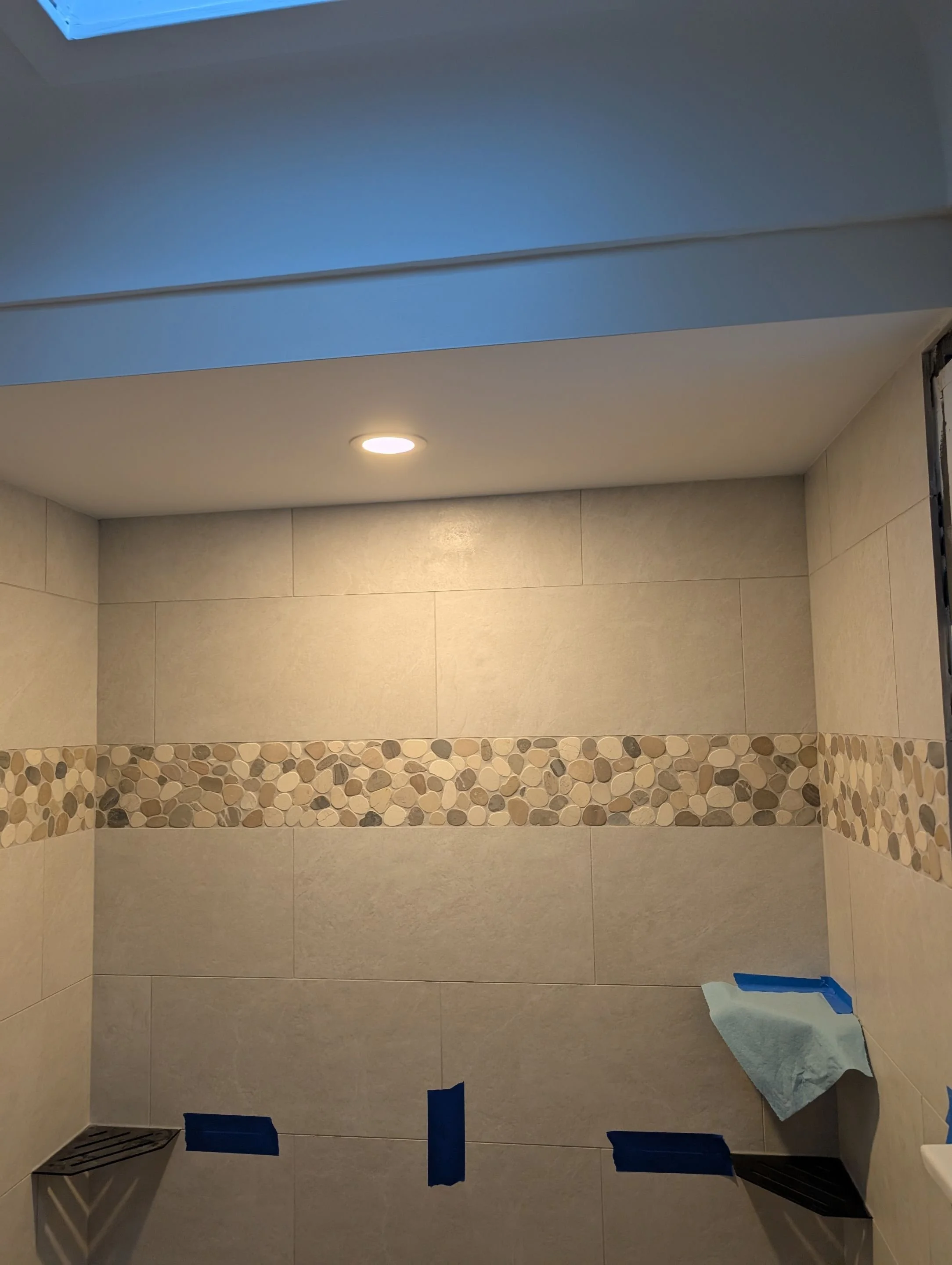 Wet-rated pot light installed in a tiled shower ceiling during a Victoria bathroom renovation