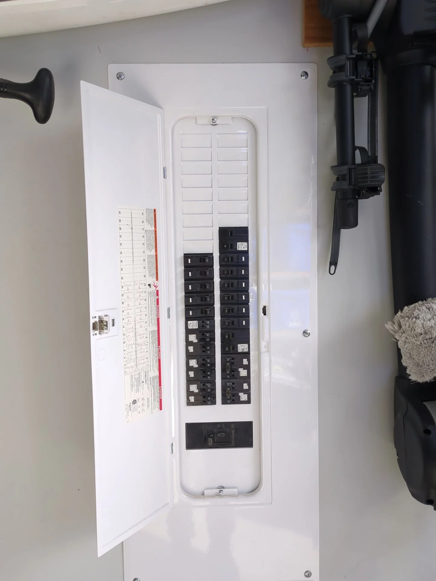 Interior electrical panel with open breaker positions confirmed before adding a 60 amp hot tub circuit