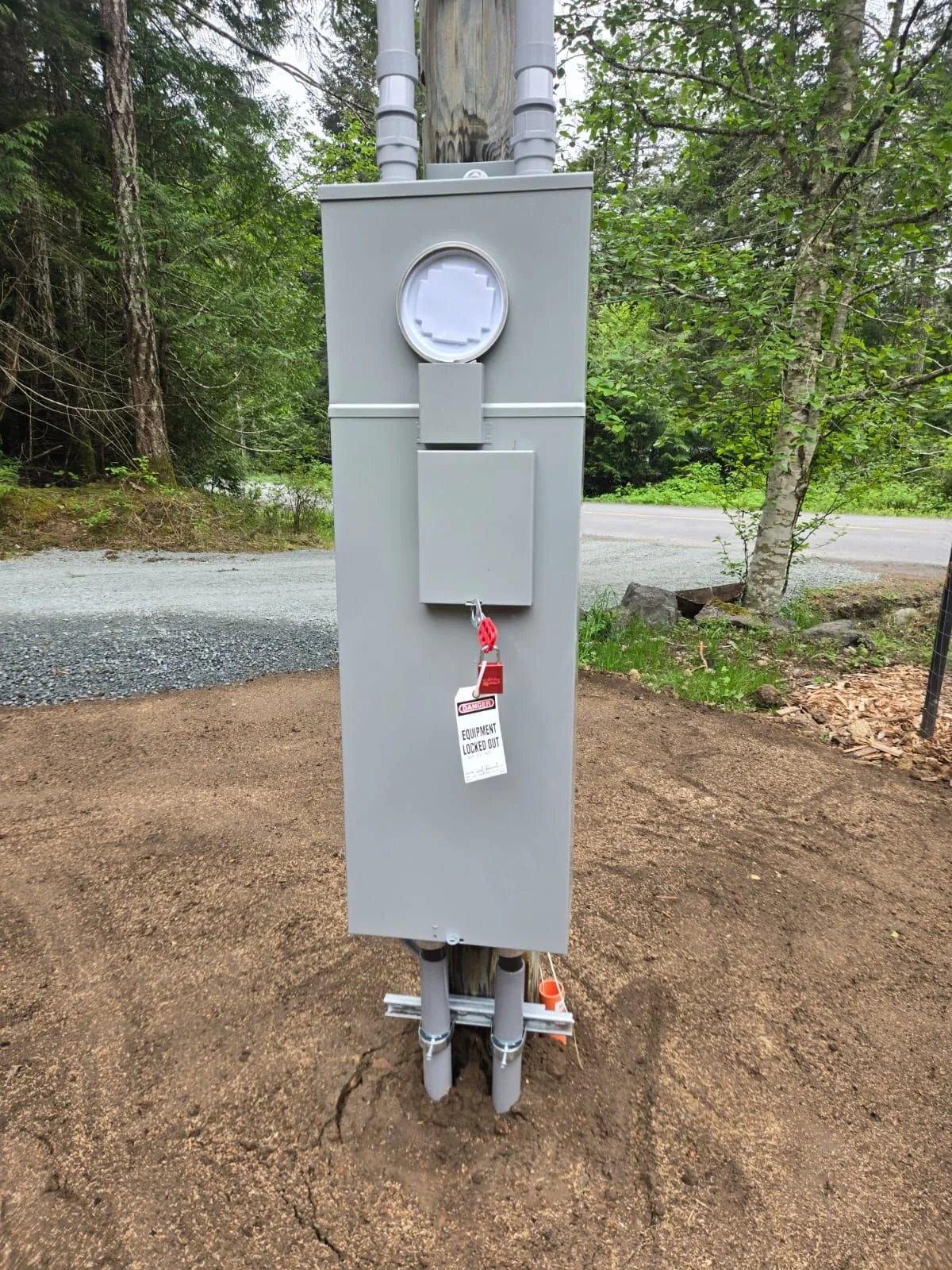 New 400 amp meter base and service equipment mounted on the exterior wall of a home