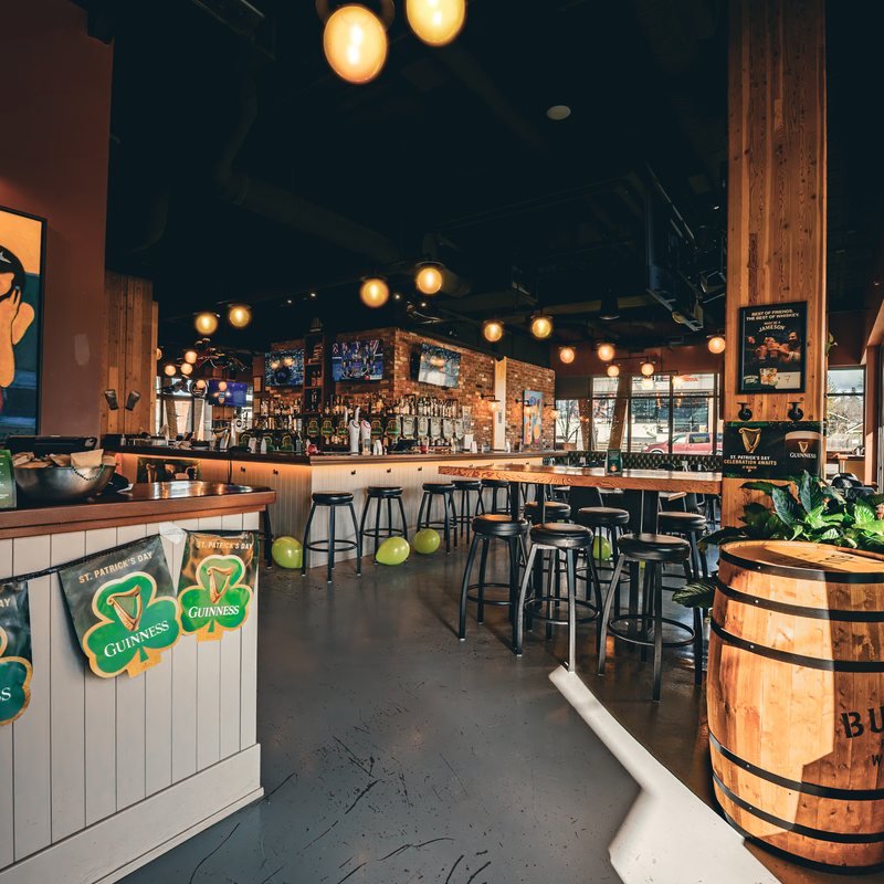 Pendant lighting above the main bar and under-counter accent lighting at Saxe Point Public House