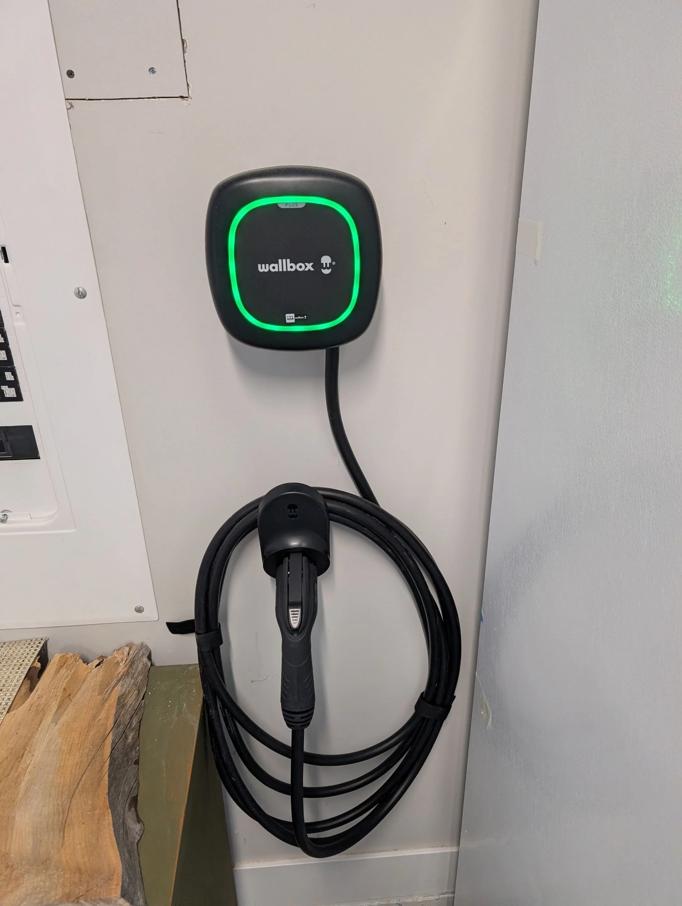 an image of a wallbox pulsar plus EV charger installed in a garage by grifflyn electric