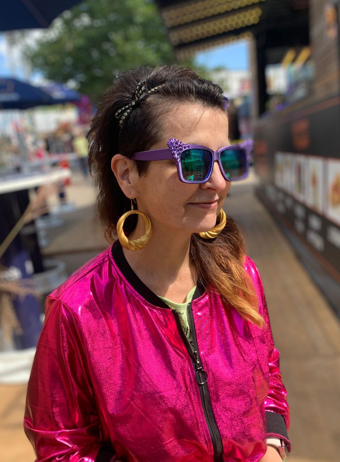 Person wearing 3d printed spiral round earrings