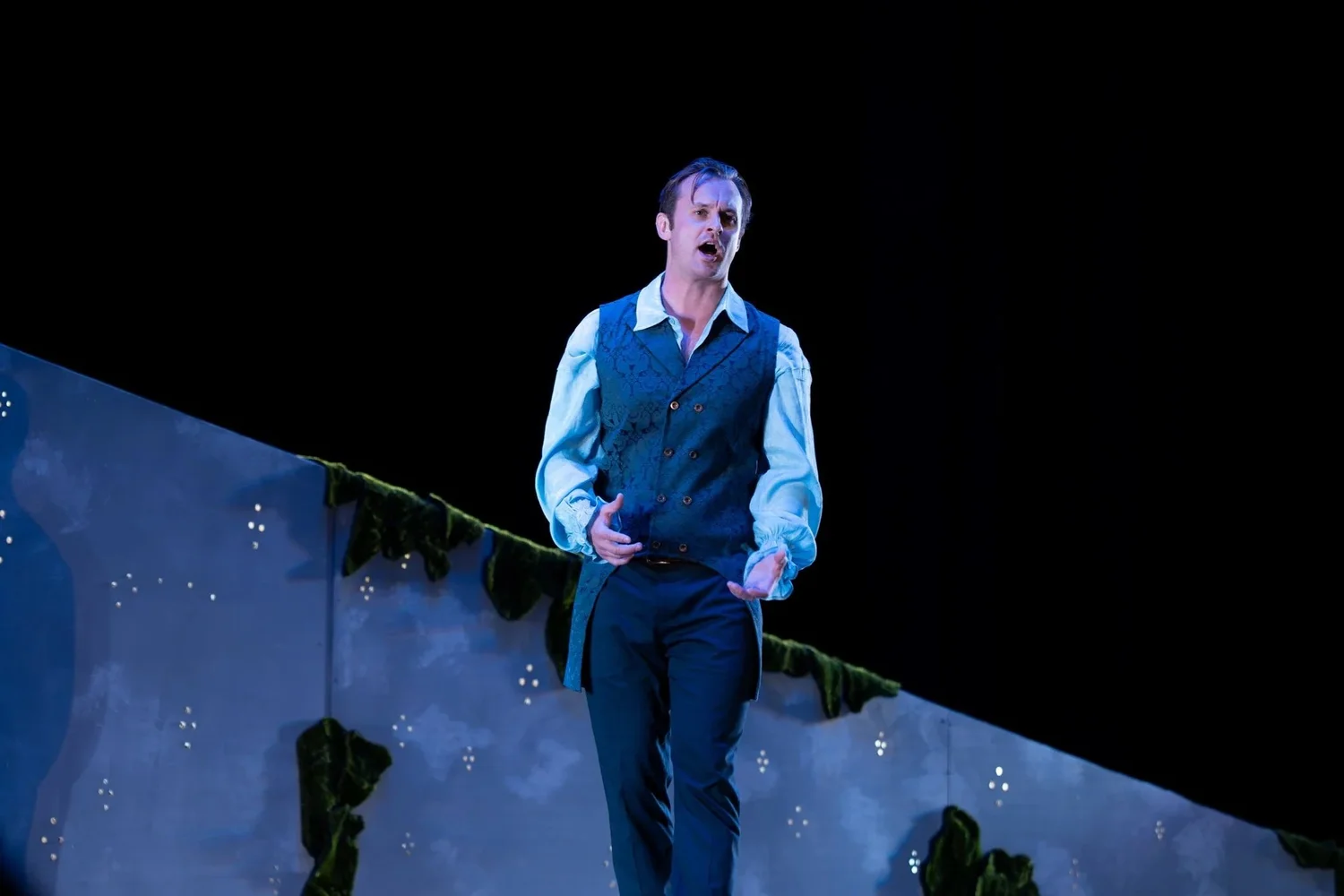 A singer on a starlit Park City Opera stage