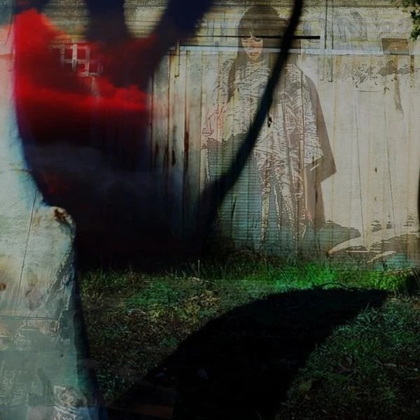 Abstract artwork with a red-tinted hand overlaying a ghostly figure in a kimono, standing against a wooden background. The scene includes dark shadows and green grass.
