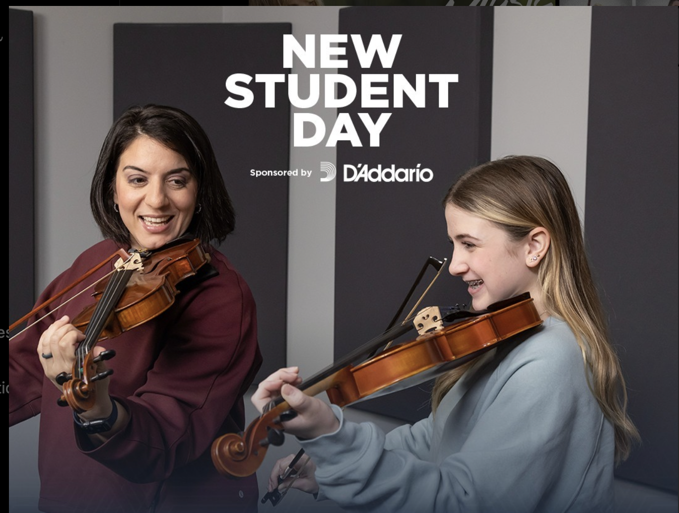 Two women playing violins and smiling during a New Student Day event, sponsored by D'Addario, in a modern indoor setting.