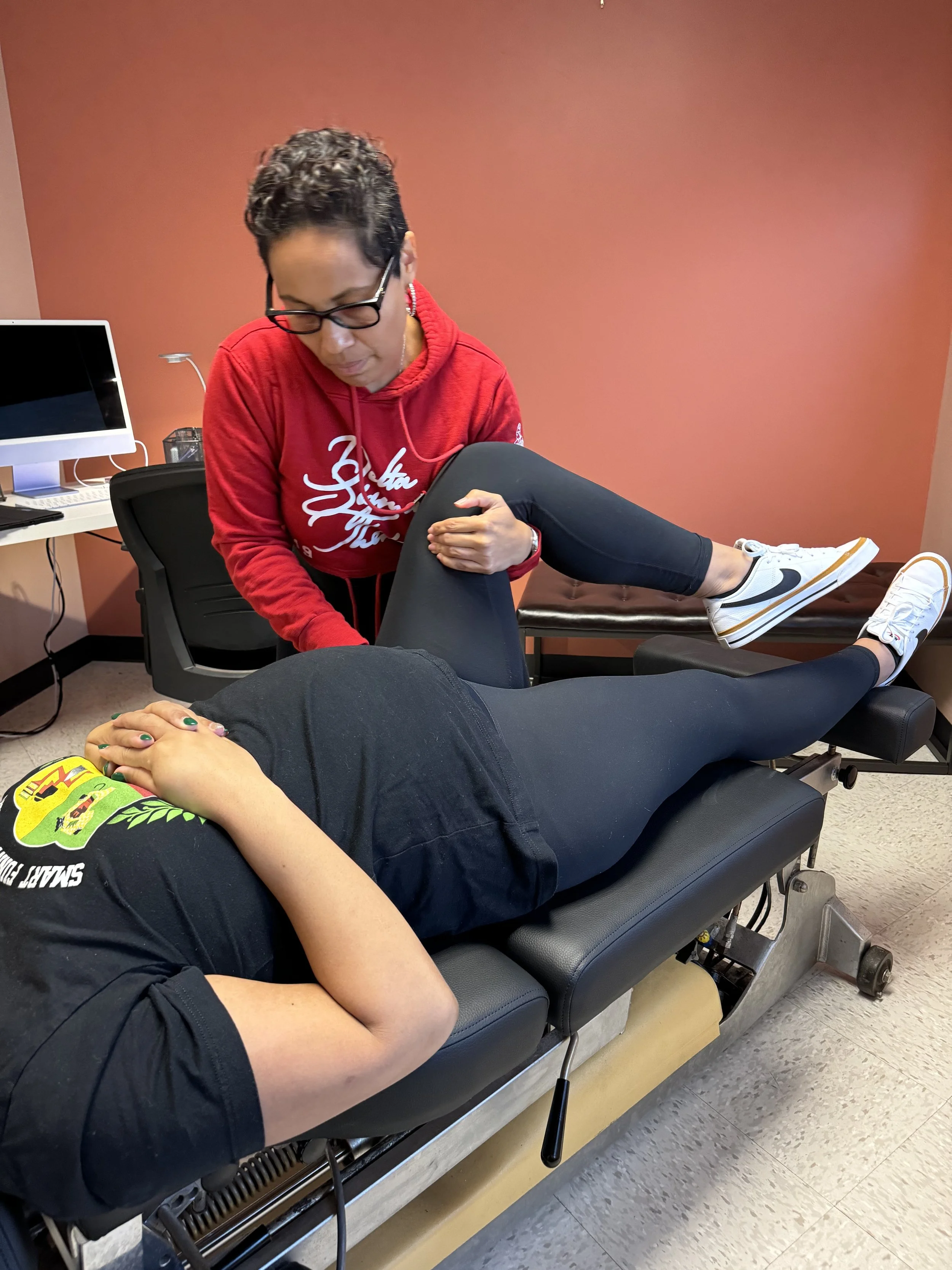 Chiropractor working with a pregnant patient