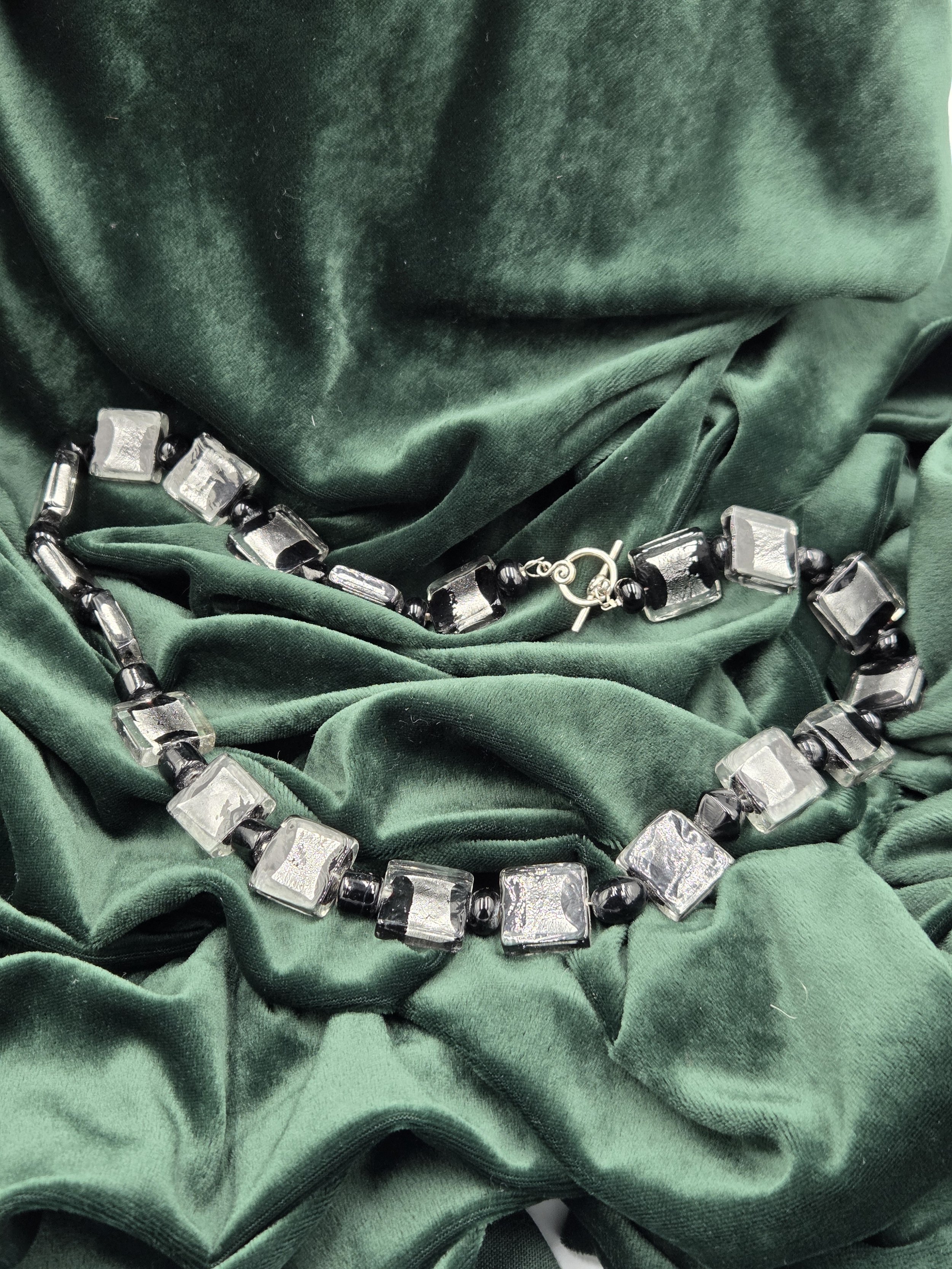 OOAK necklace with large square black lampwork glass beads and shimmering silver foil accents.