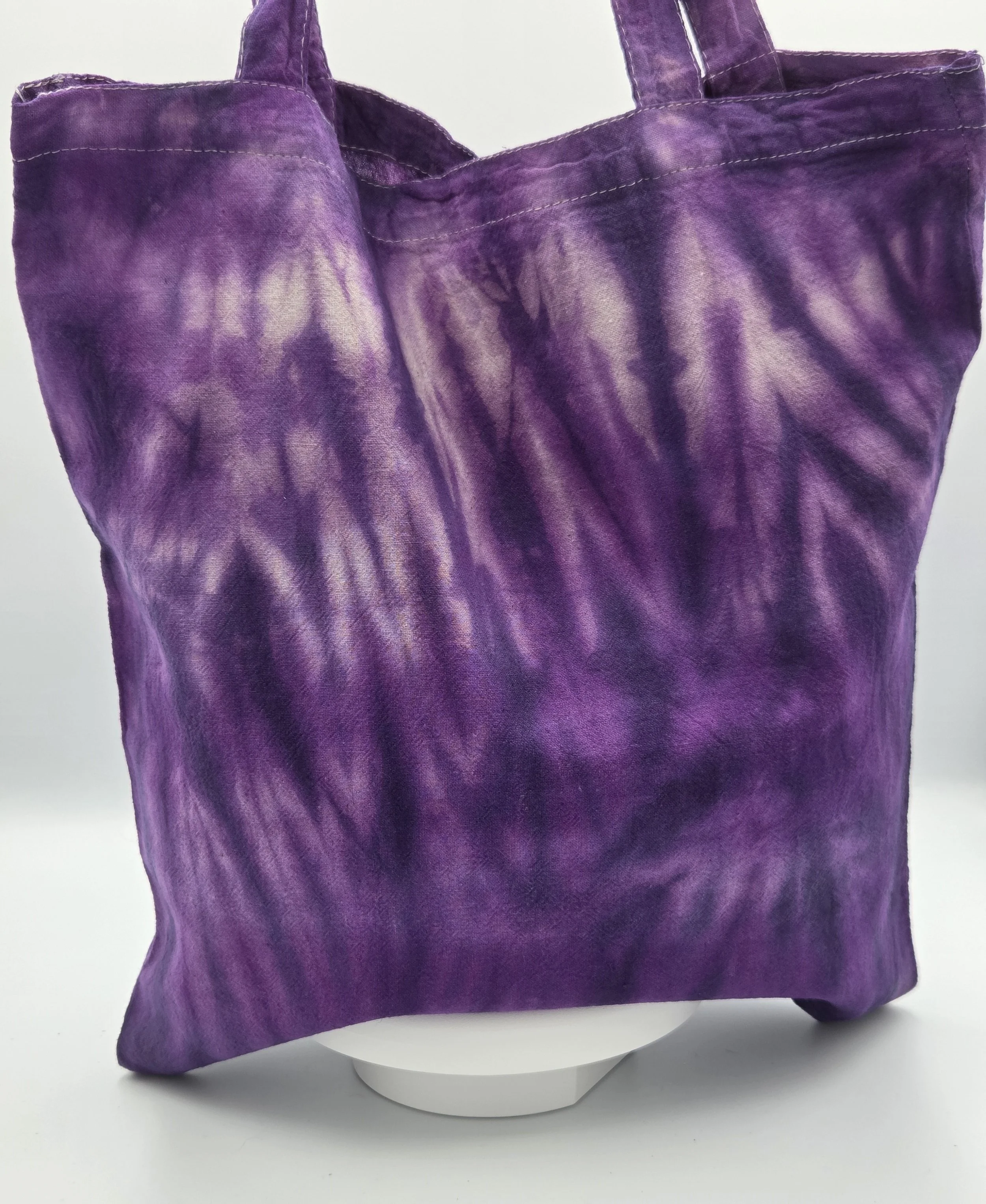 Livity Original hand-dyed calico cotton tote bag featuring a deep purple 'Tiger Skin' vertical resist pattern. One-of-a-kind textile art handmade in Canberra.