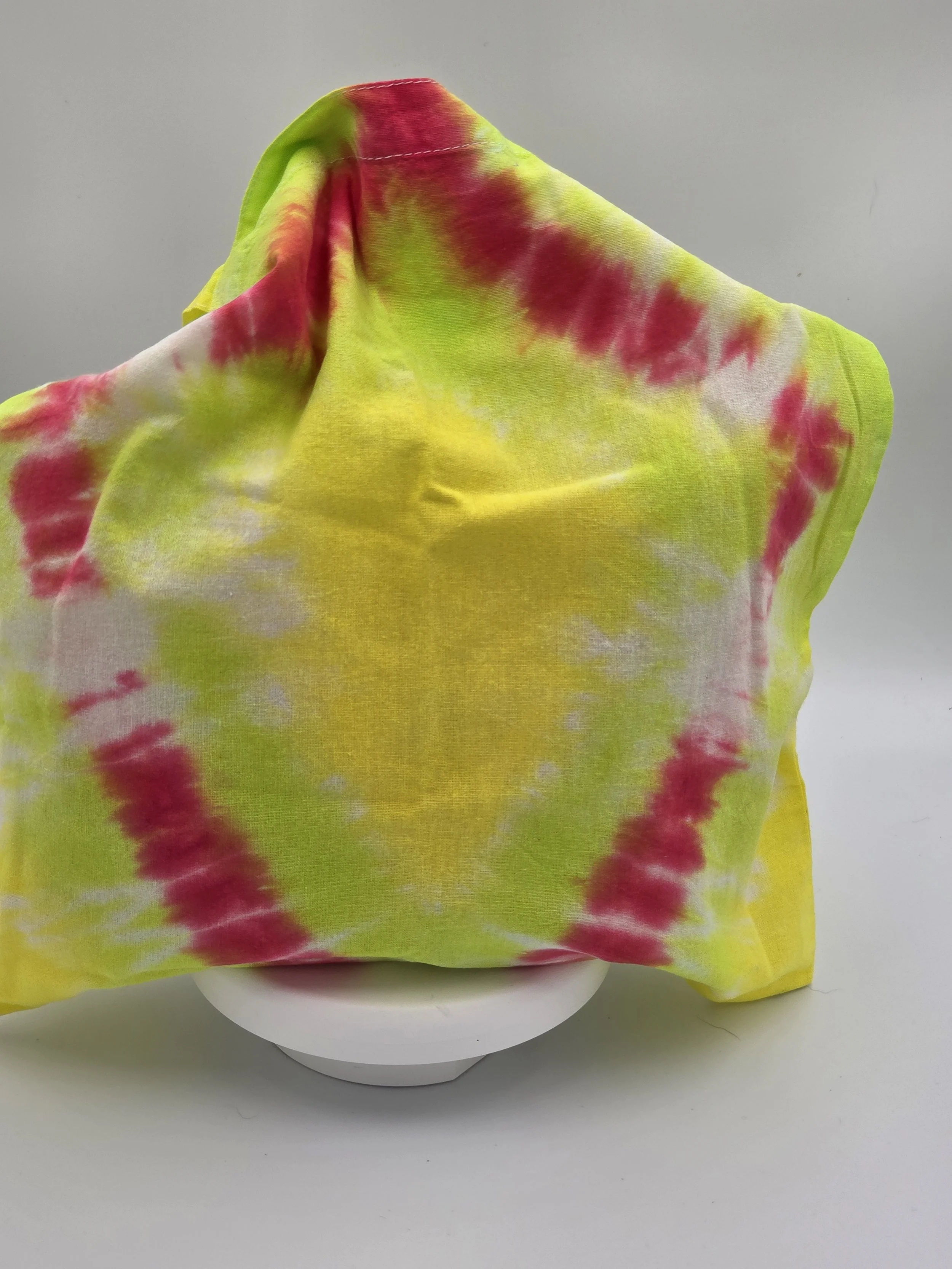 Hand-dyed cotton tote bag with a fuchsia diamond center on a lime and yellow background. OOAK textile art by Livity Studio.