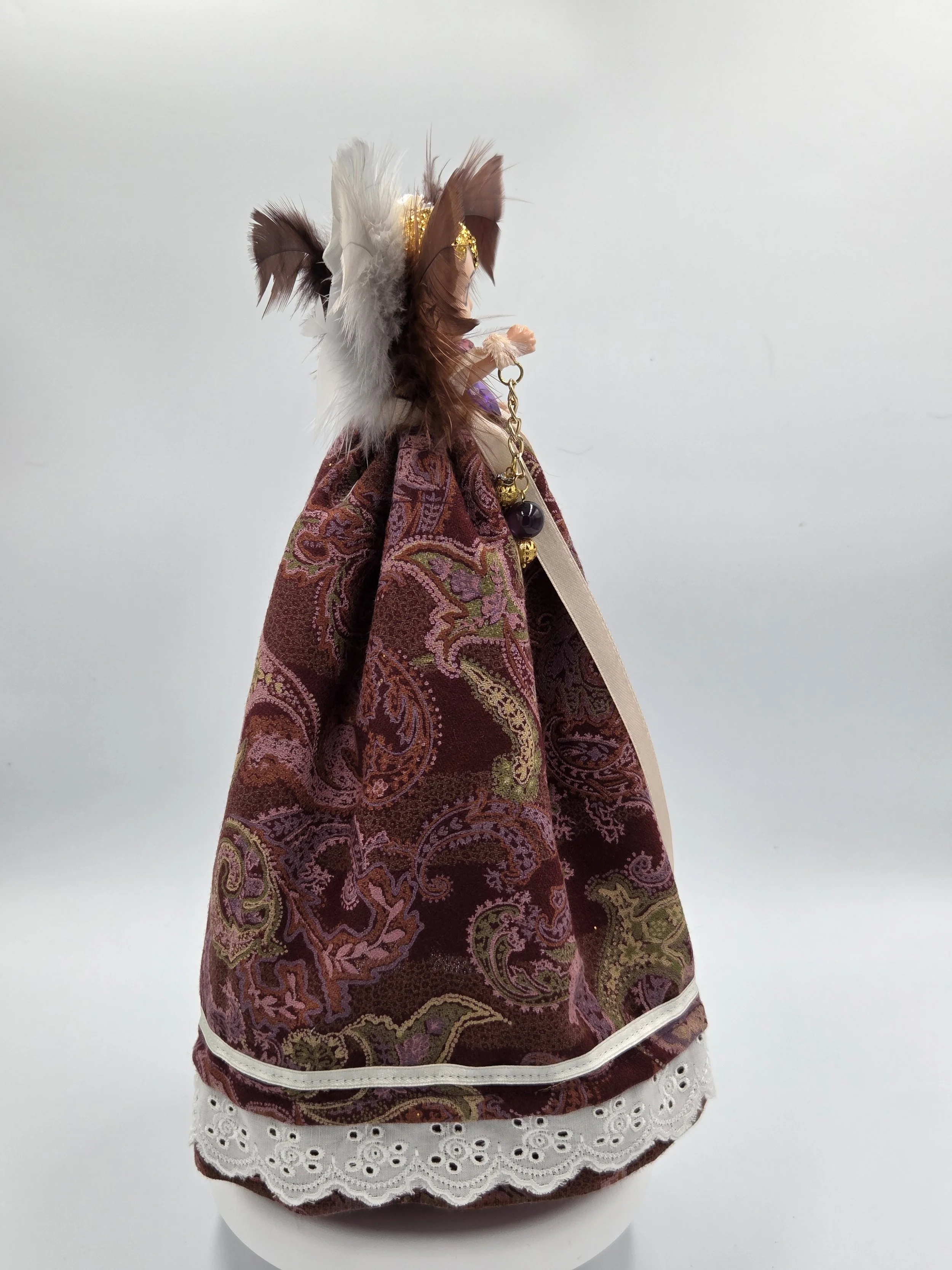 Rear view showing the lush texture of the brown and cream-grey feathers.