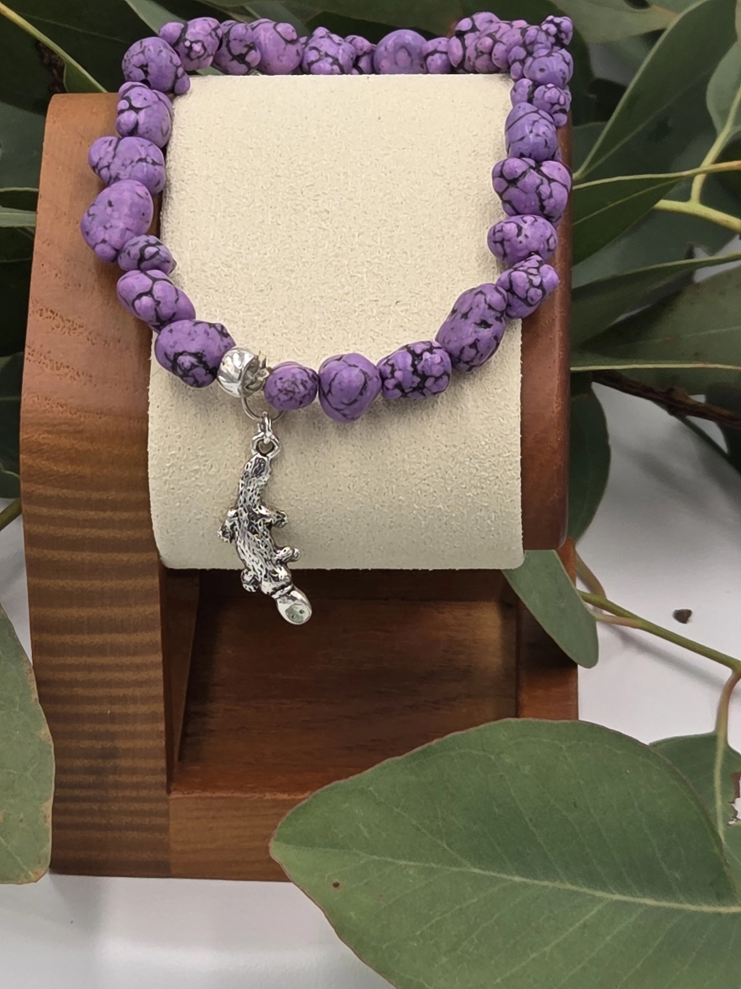 OOAK purple Howlite nugget bracelet with silver platypus charm with background of gum leaves