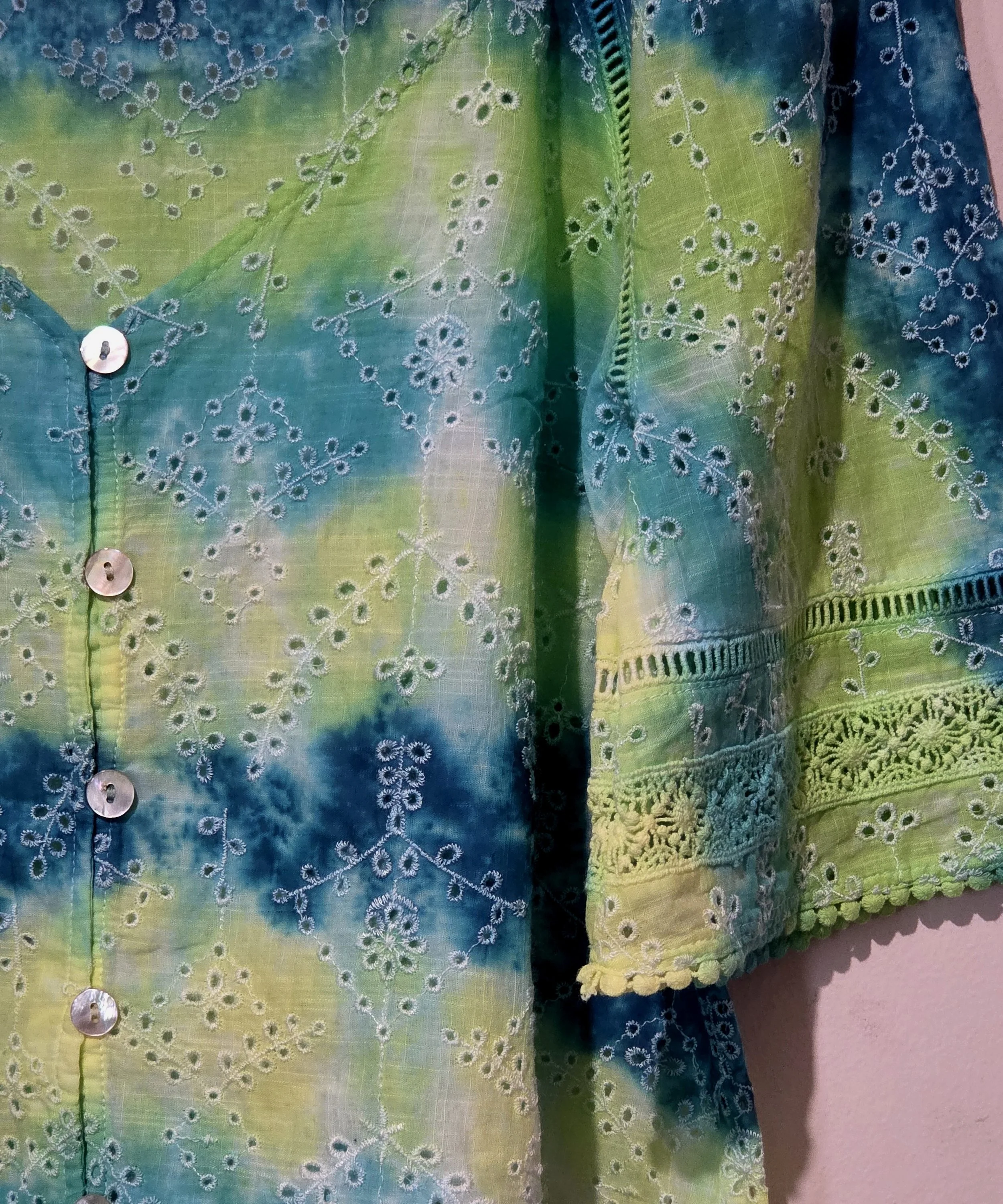 women's size 10 V-neck top with overlocked fern eyelets and horizontal tie-dye bands in green, lime, teal, and yellow.