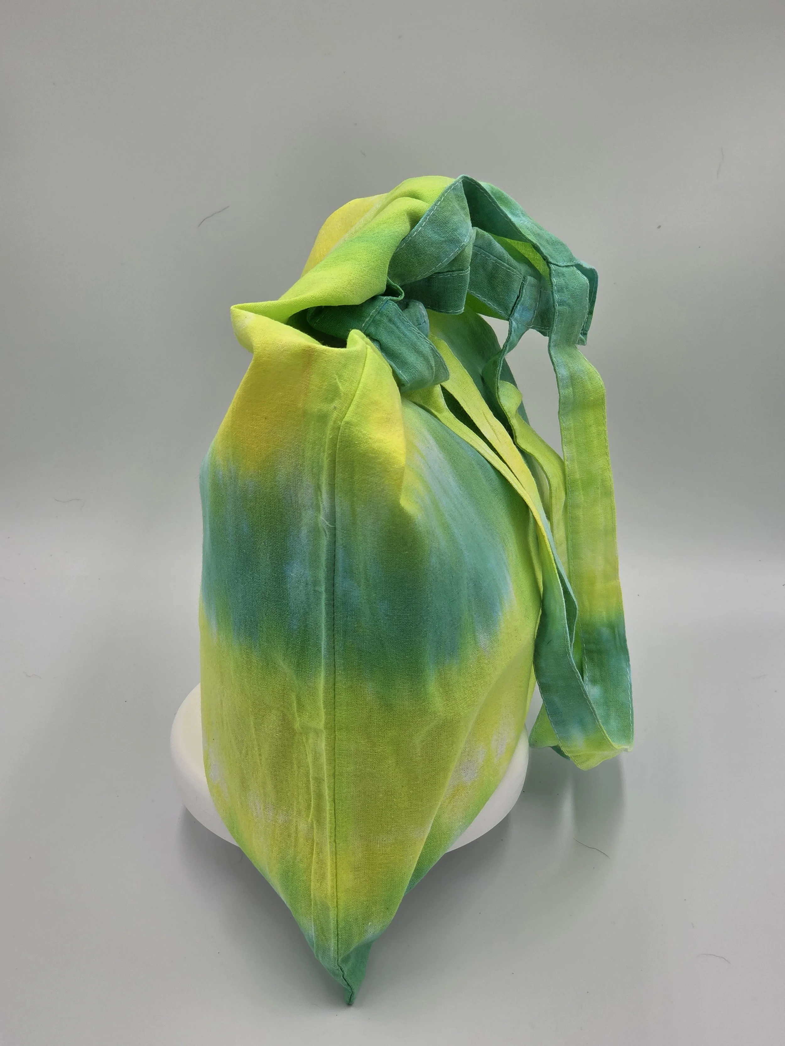 Hand-dyed cotton tote bag with horizontal lime, green, and yellow stripes. OOAK textile art handmade in Canberra by Livity Studio.
