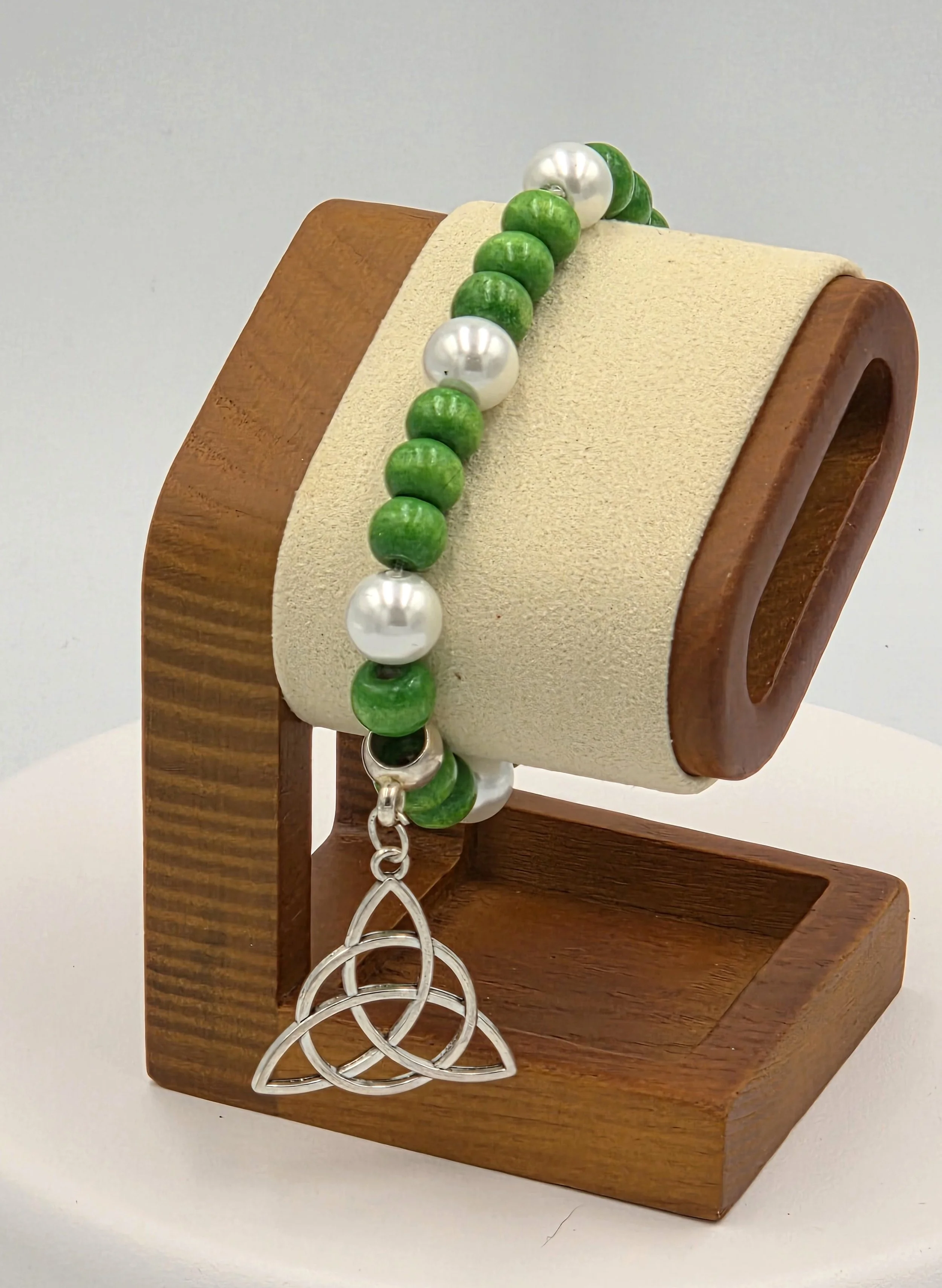 OOAK green wood and white pearl bracelet with large silver Trinity knot.