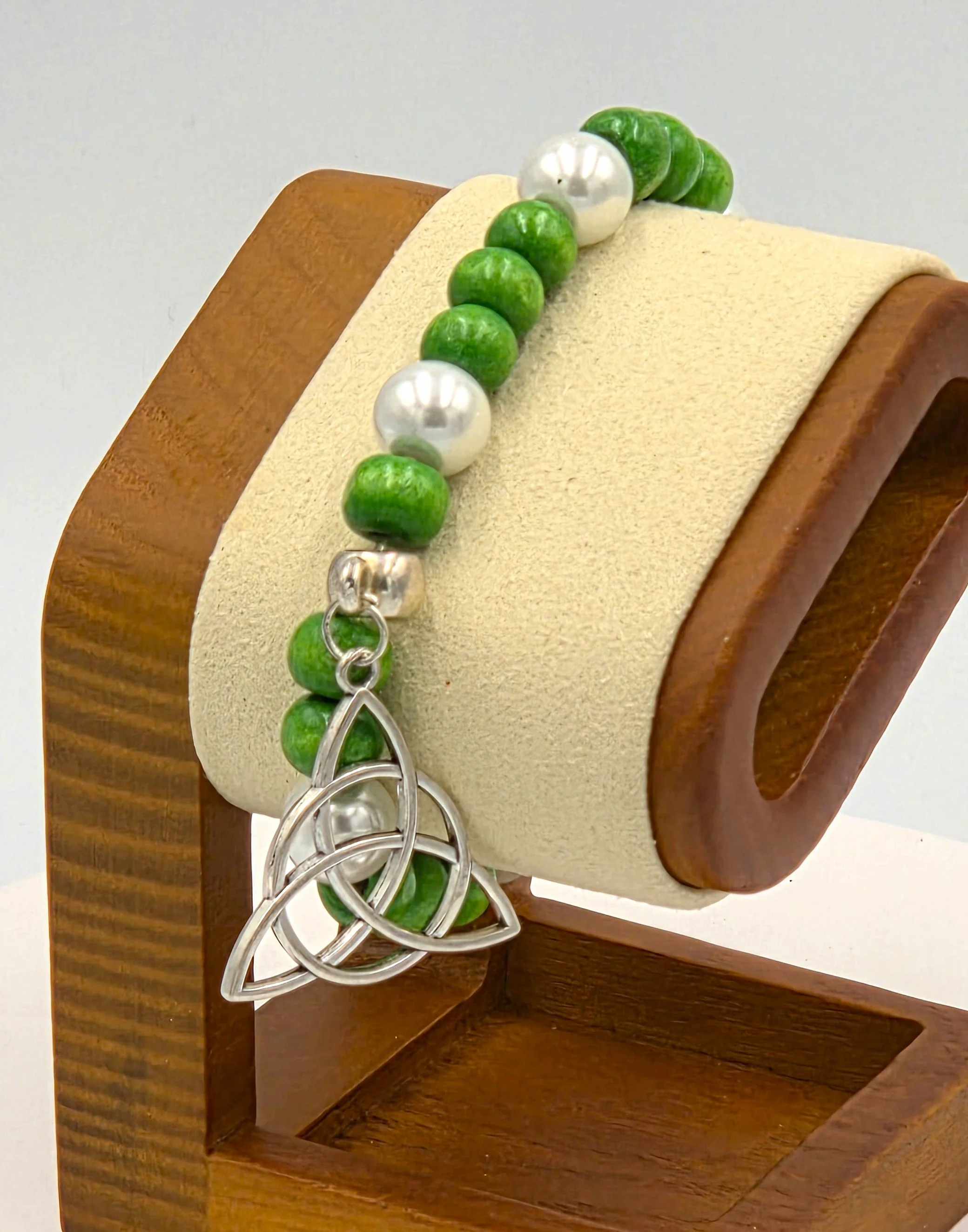 OOAK green wood and white pearl bracelet with large silver Trinity knot.