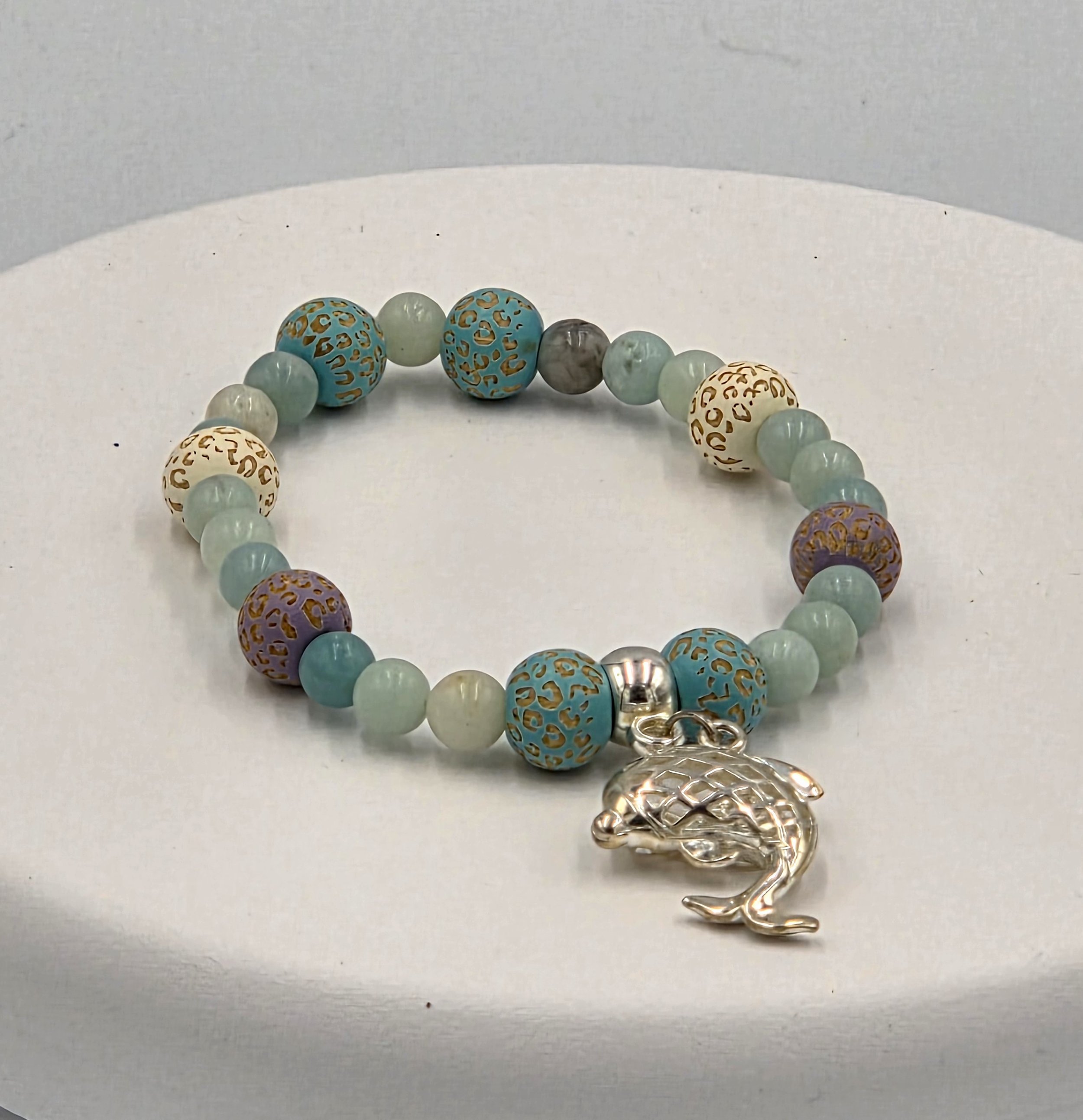 OOAK blue and mauve patterned wood and Amazonite elastic bracelet with a large silver dolphin.