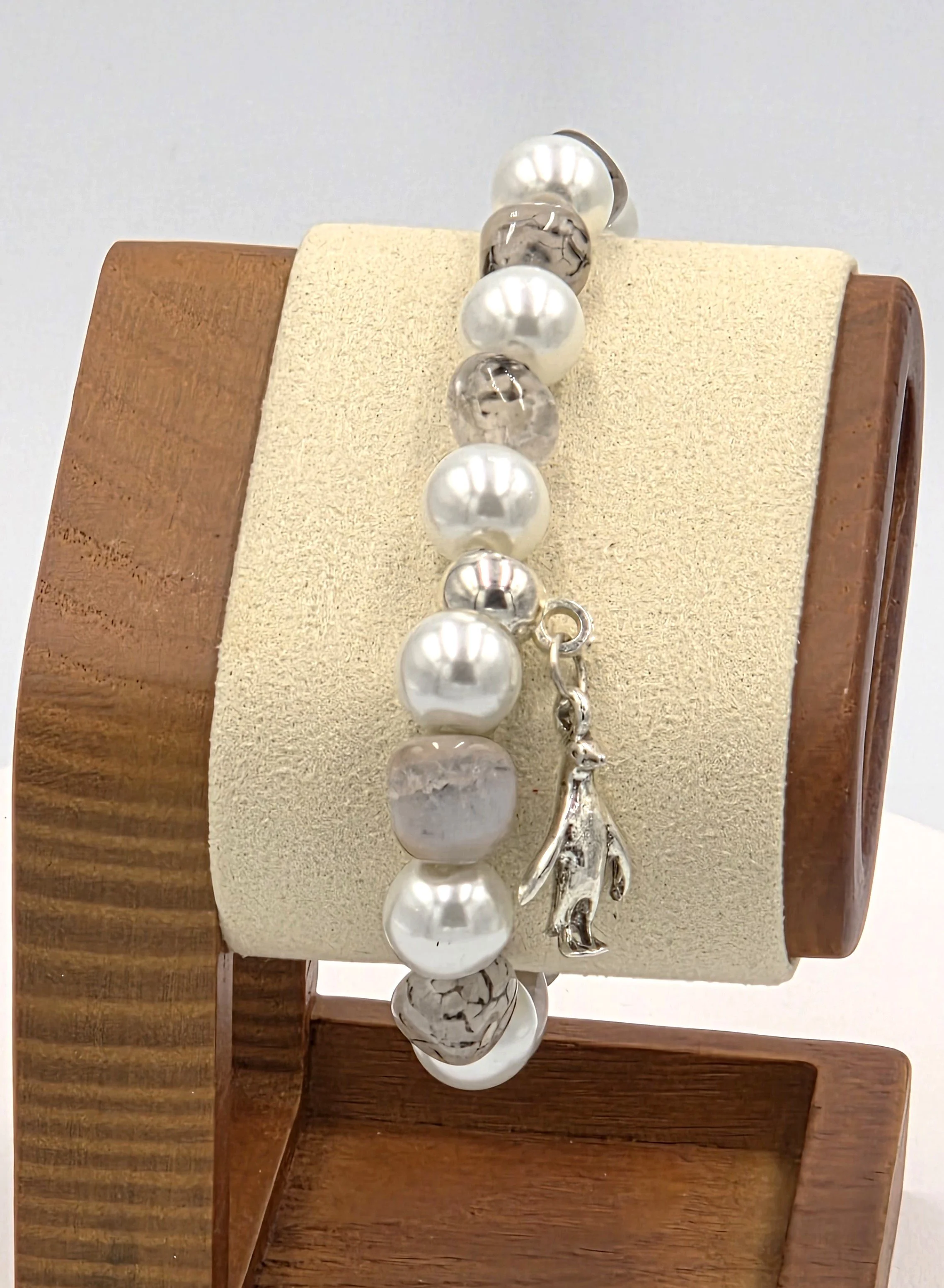 OOAK white pearl and translucent brown agate bracelet with silver penguin charm.