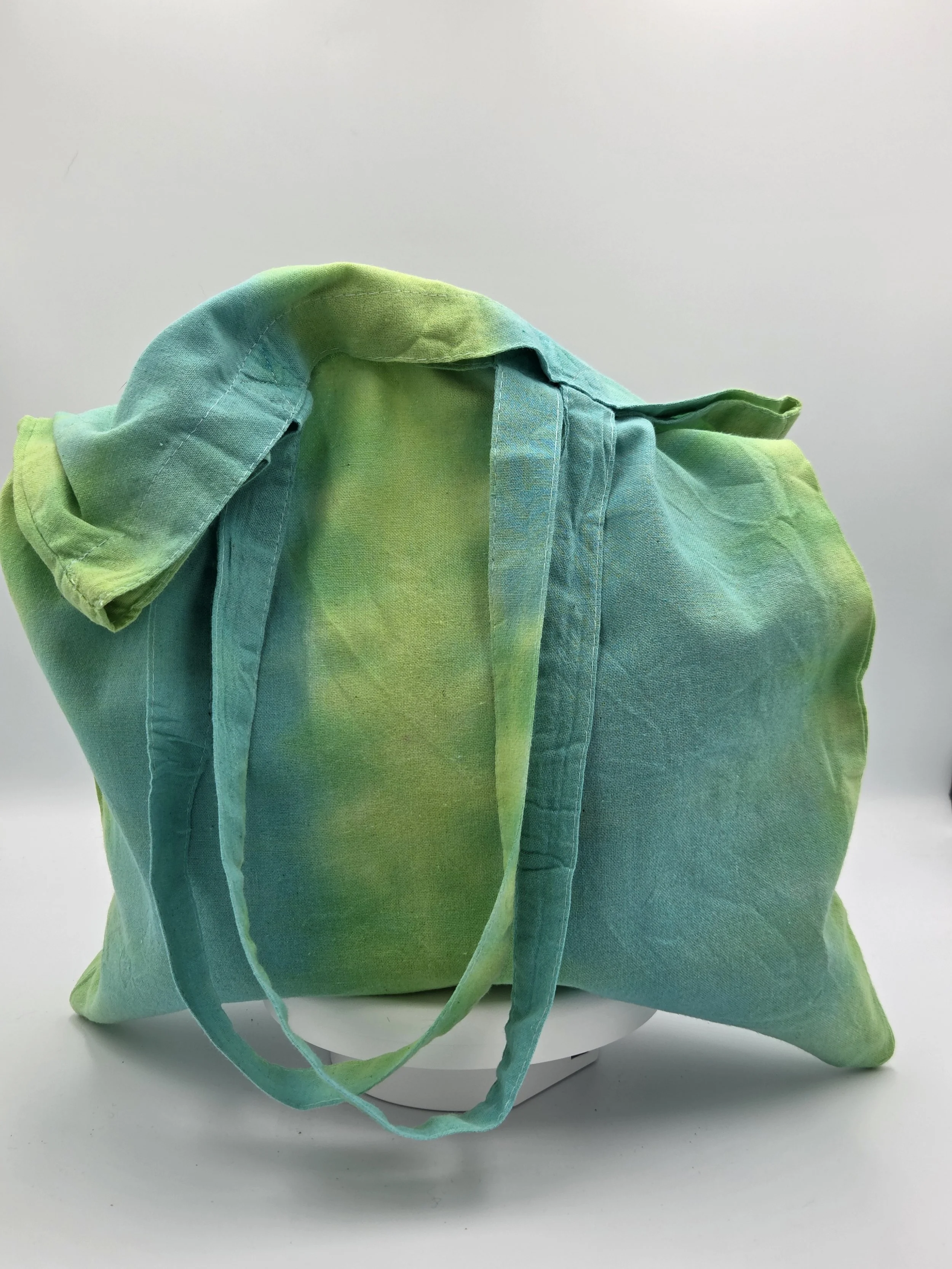 "Artisan handmade tote bag featuring wide vertical stripes of lime green and teal. Eco-friendly 100% cotton shopper by Livity and the Creative i."