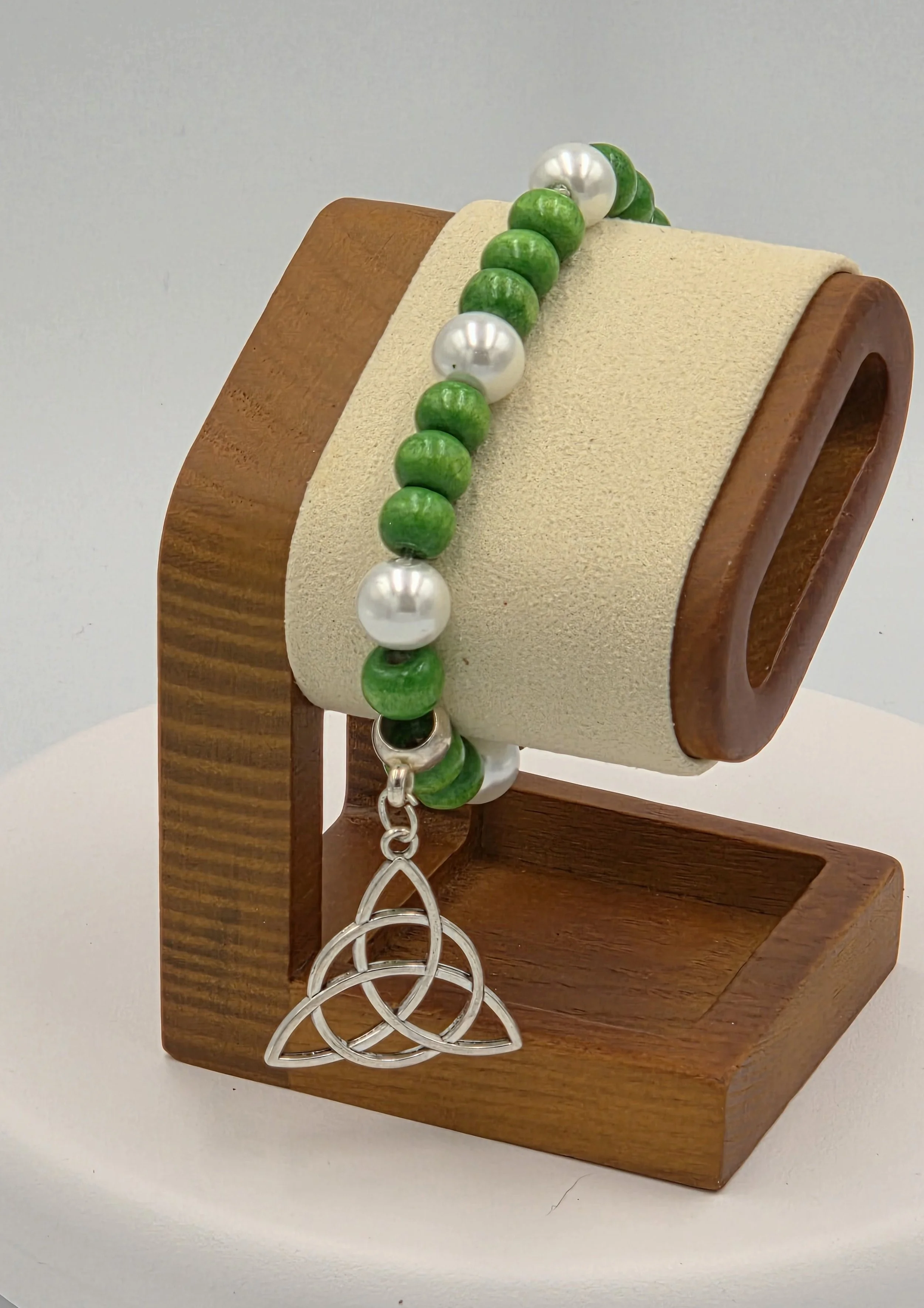 OOAK green wood and white pearl bracelet with large silver Trinity knot.