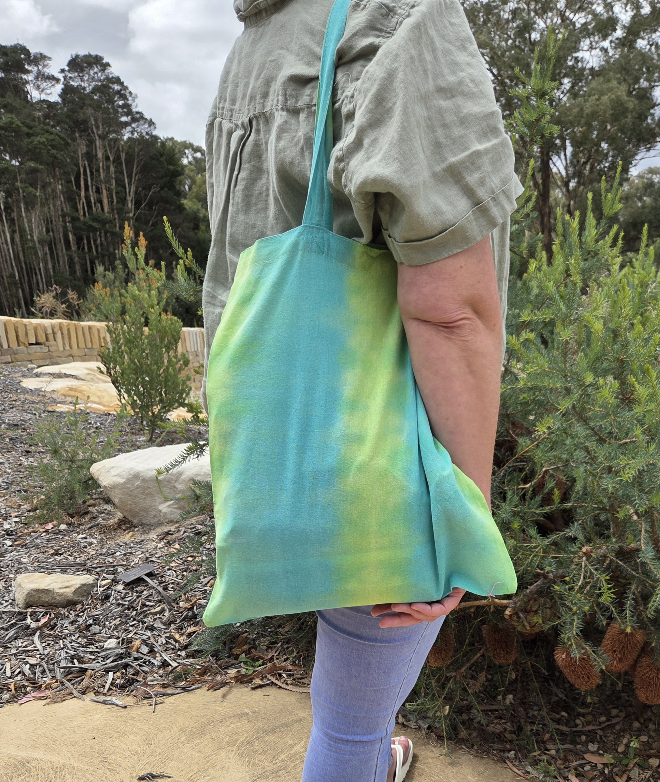 "Artisan handmade tote bag featuring wide vertical stripes of lime green and teal. Eco-friendly 100% cotton shopper by Livity and the Creative i."