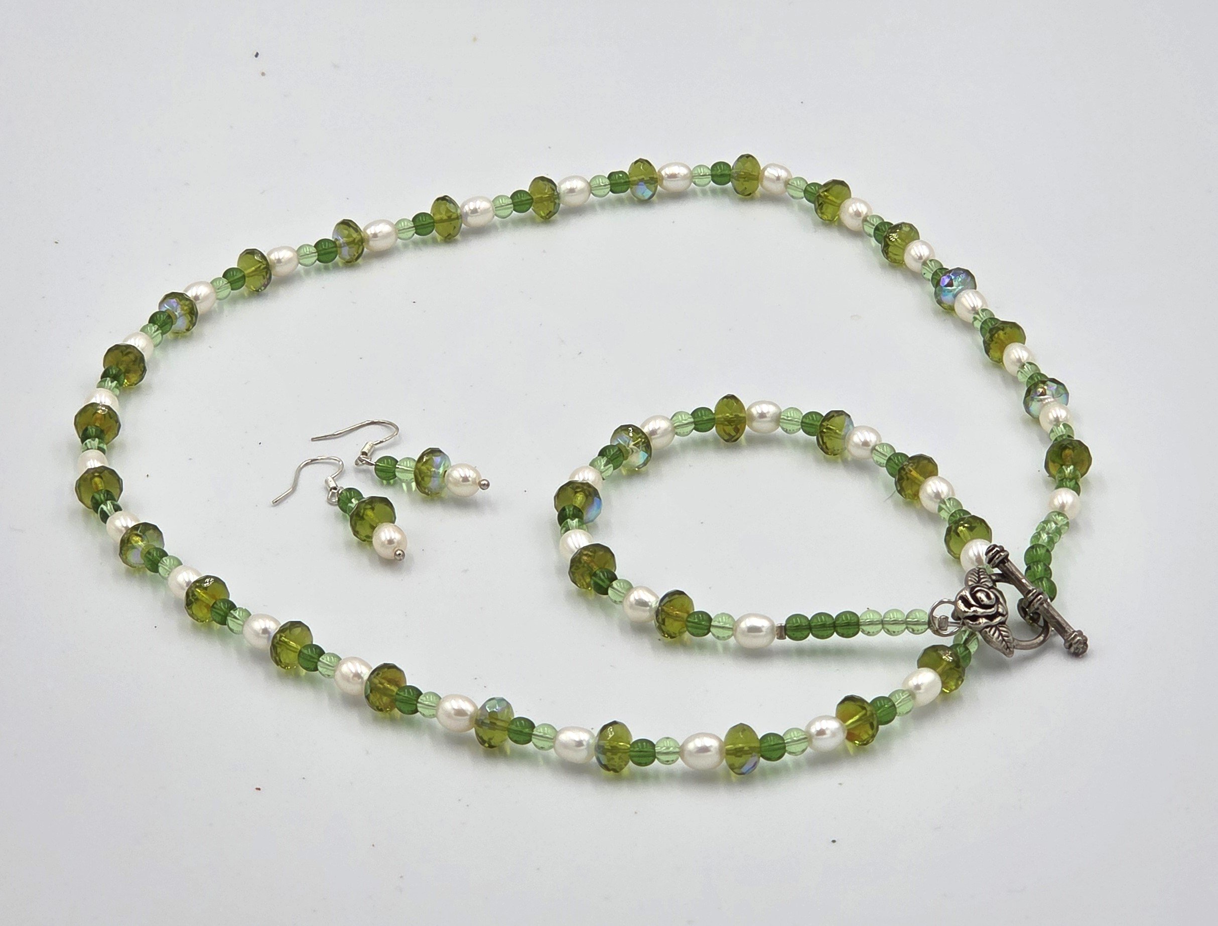Long pearl and sparkling lime green crystal necklace with matching earrings.
