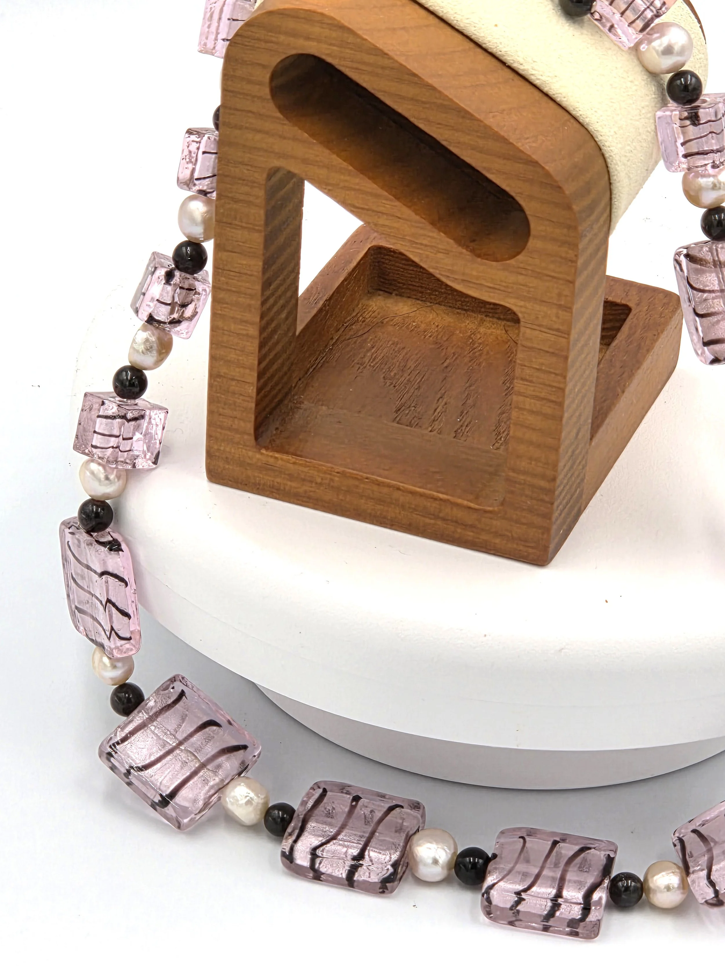 Pink and black striped silver-foil glass rectangles with pink freshwater pearls and red garnet beads on an adjustable silver clasp necklace.