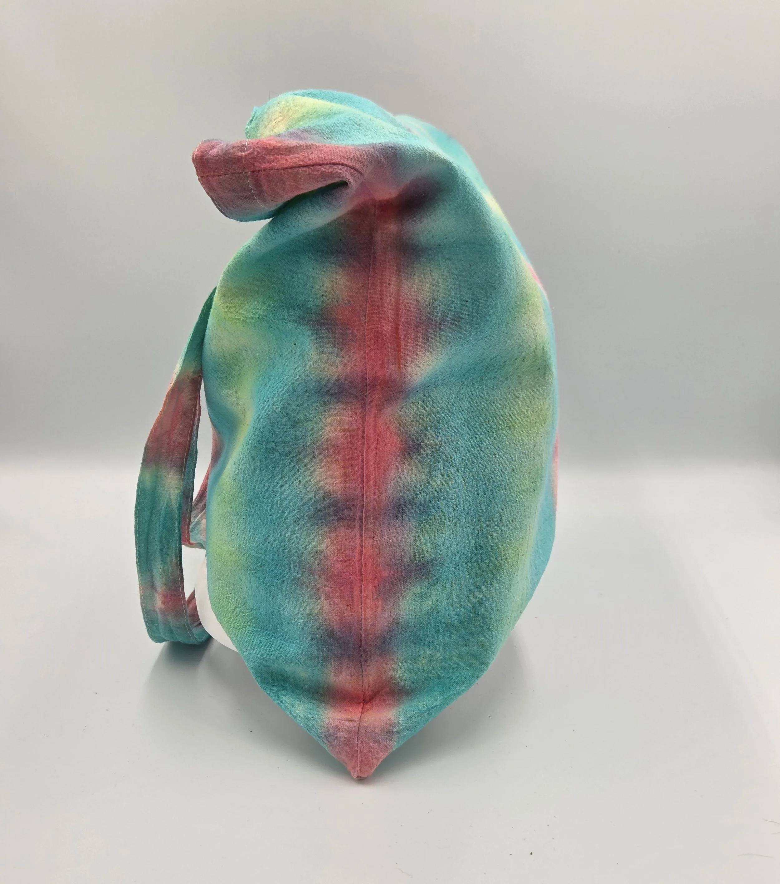 "Hand-dyed calico cotton tote bag with vertical pastel bands of bubblegum pink, teal, and lime green. One-of-a-kind textile art by Livity Studio Canberra."