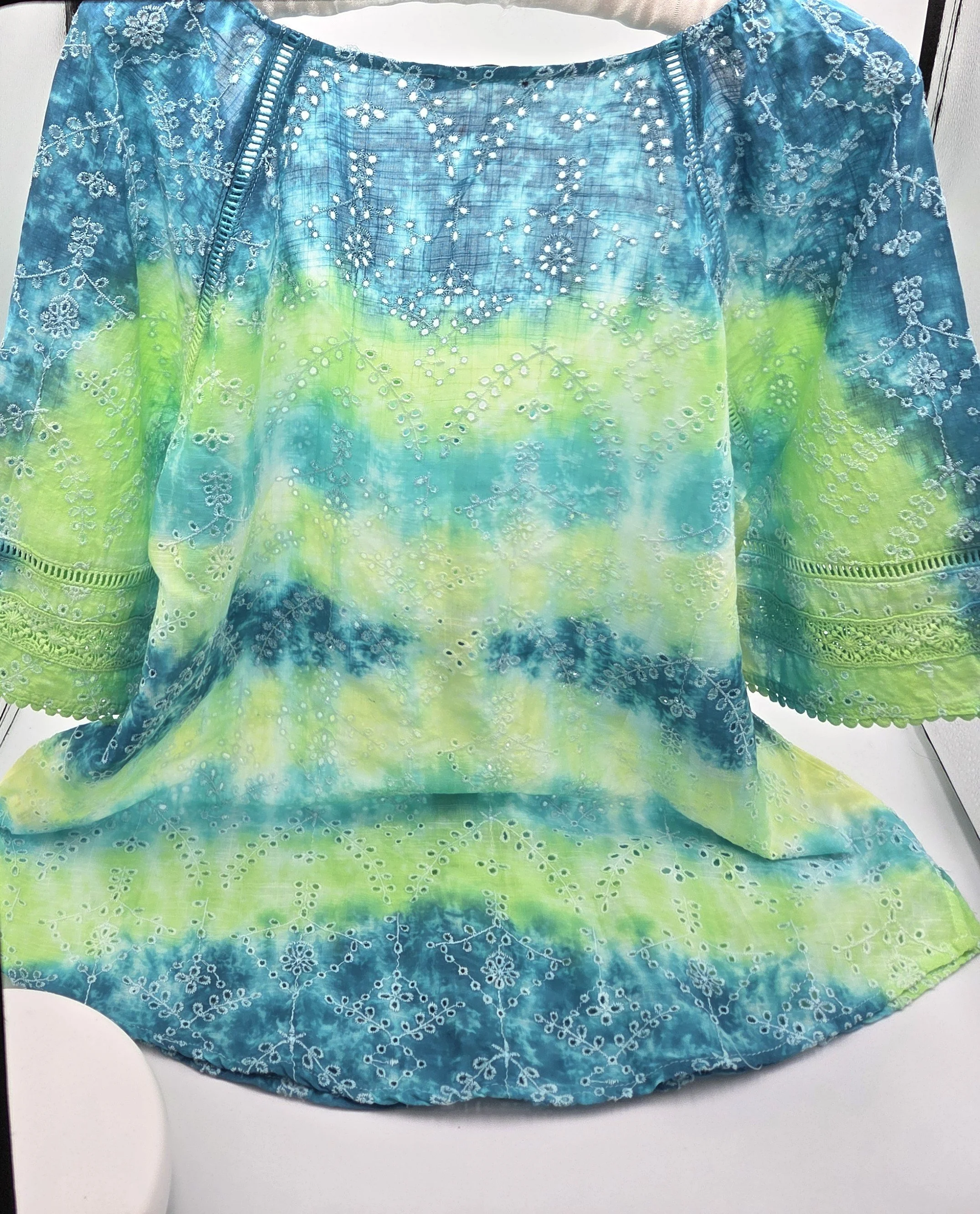 women's size 10 V-neck top with overlocked fern eyelets and horizontal tie-dye bands in green, lime, teal, and yellow.