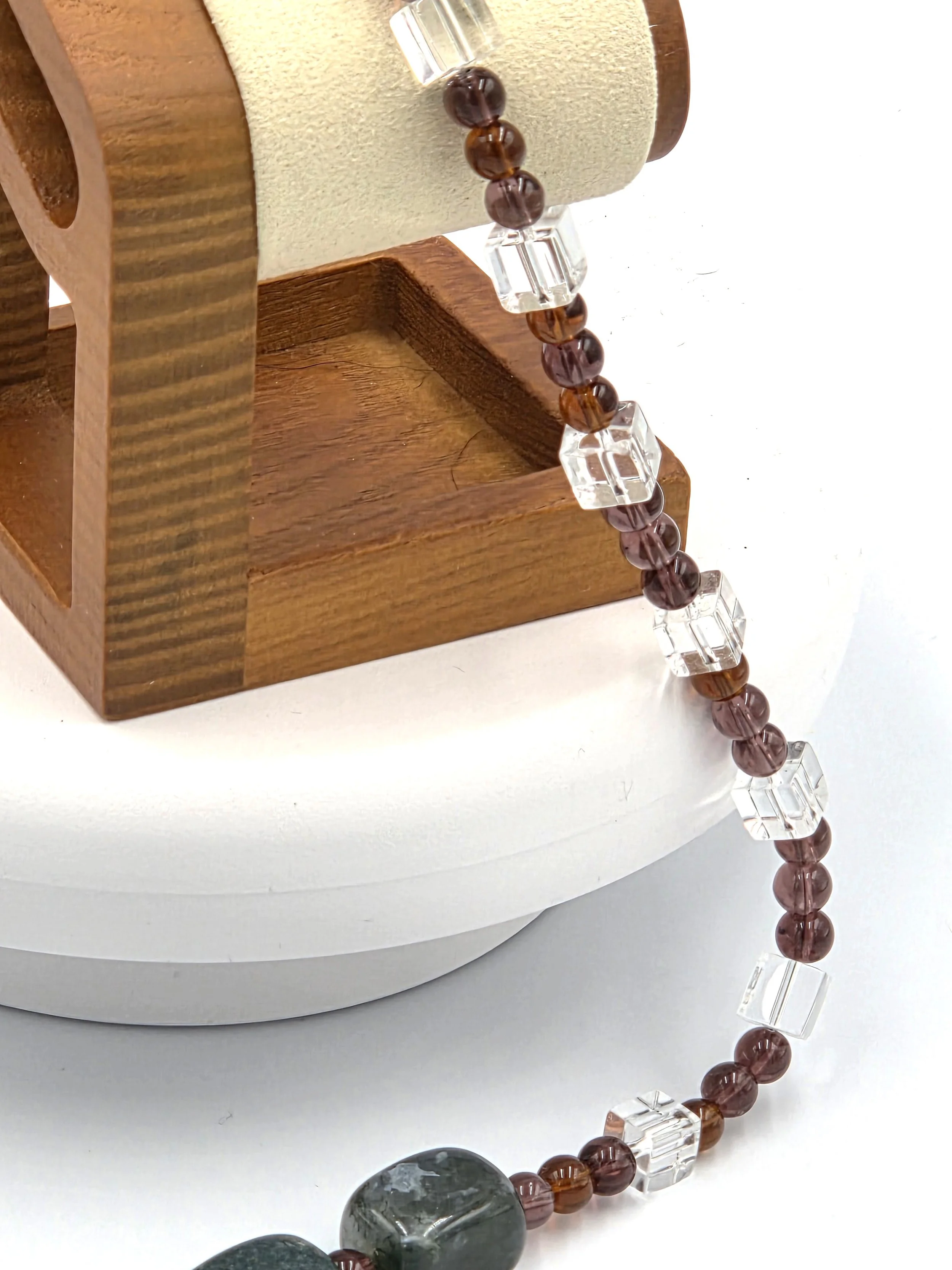 Large Moss Agate nuggets framed by dark amber glass beads and clear glass squares on a silver toggle necklace.