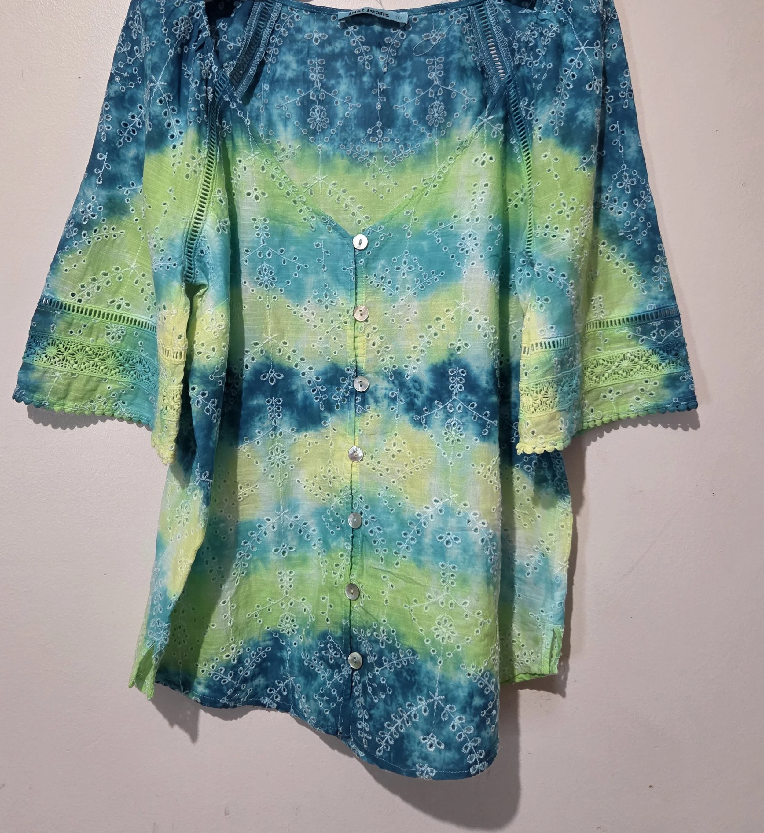 women's size 10 V-neck top with overlocked fern eyelets and horizontal tie-dye bands in green, lime, teal, and yellow.