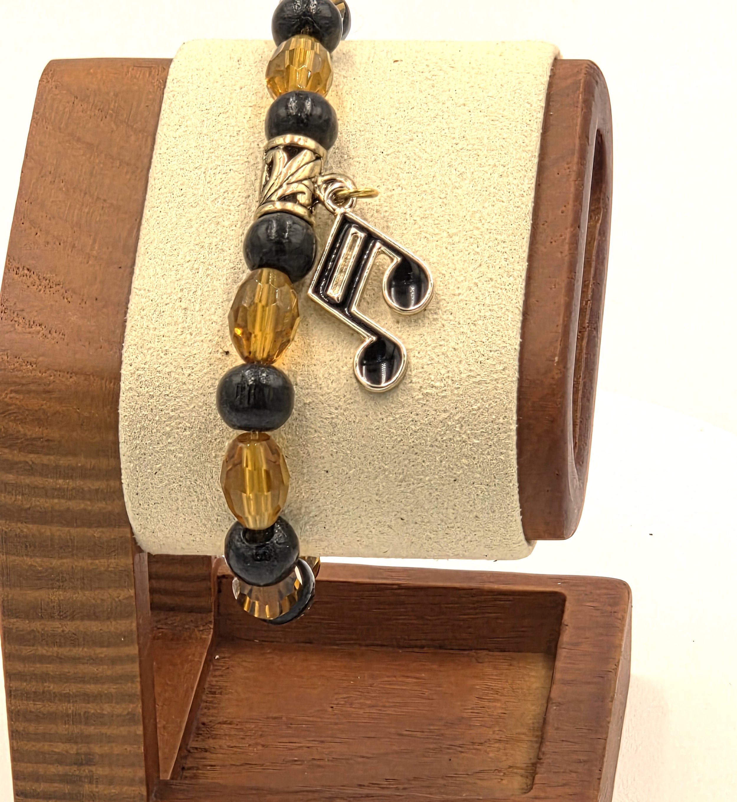 OOAK amber glass and black wood bracelet with gold & black musical note charm.