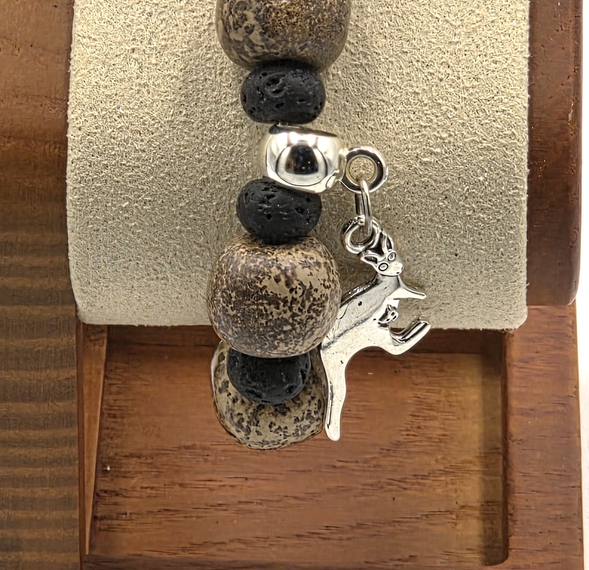 close up of OOAK Australian Heritage brown jasper and black lava bead bracelet with silver kangaroo charm.