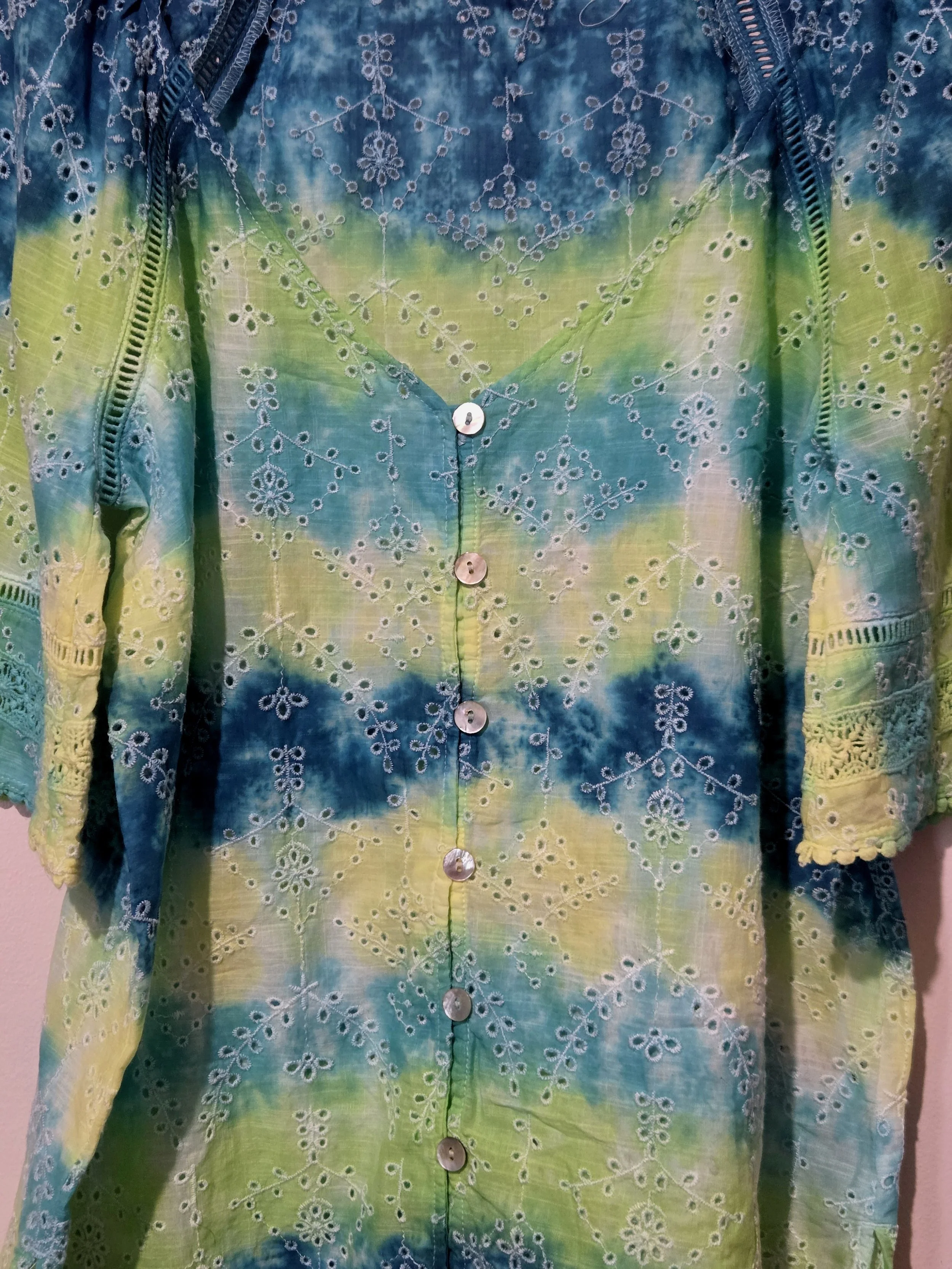 women's size 10 V-neck top with overlocked fern eyelets and horizontal tie-dye bands in green, lime, teal, and yellow.