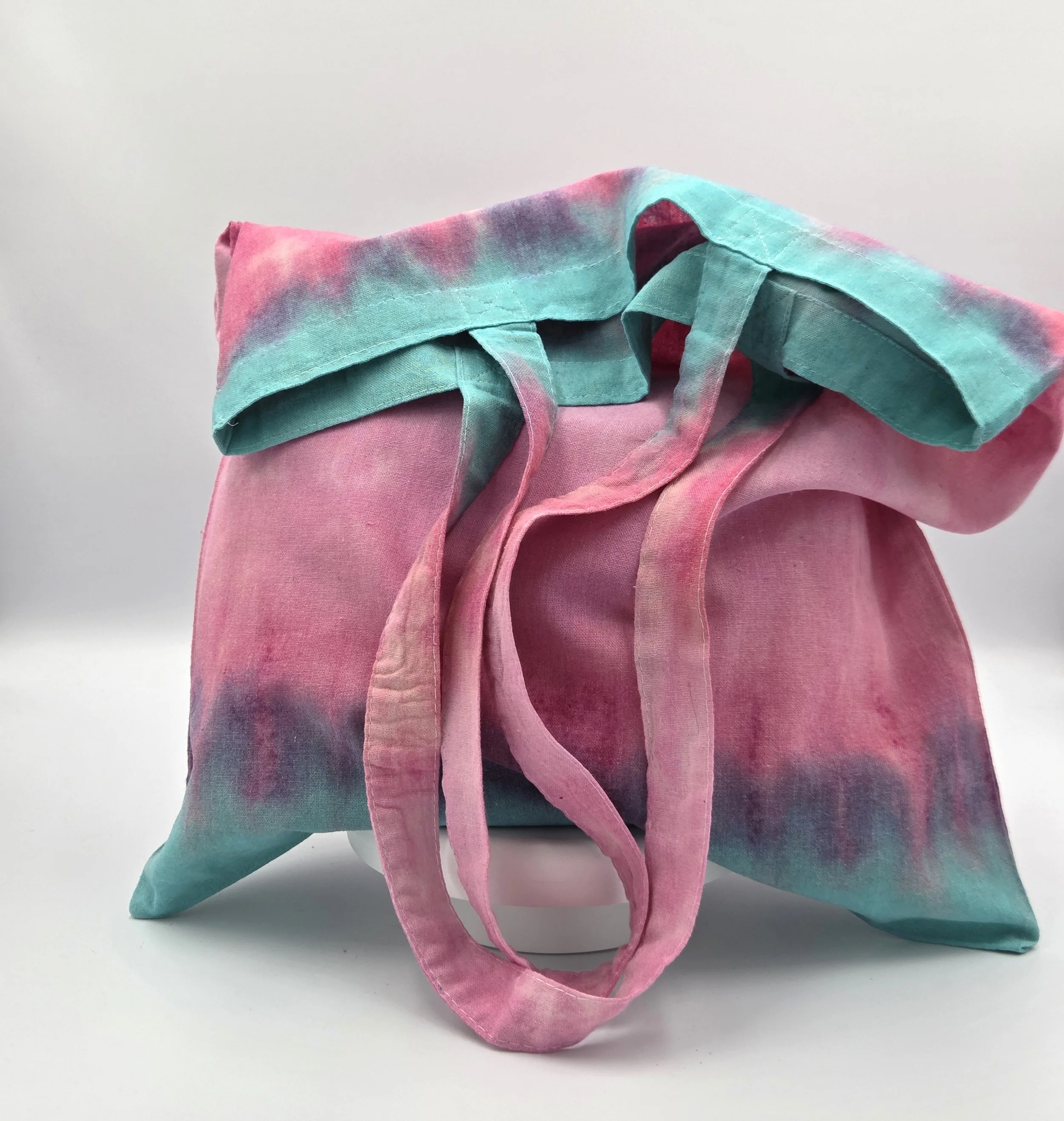 OOAK textile art tote bag with horizontal layers of soft green, dusky pink, and light pink. Hand-dyed natural cotton bag by Livity Studio.