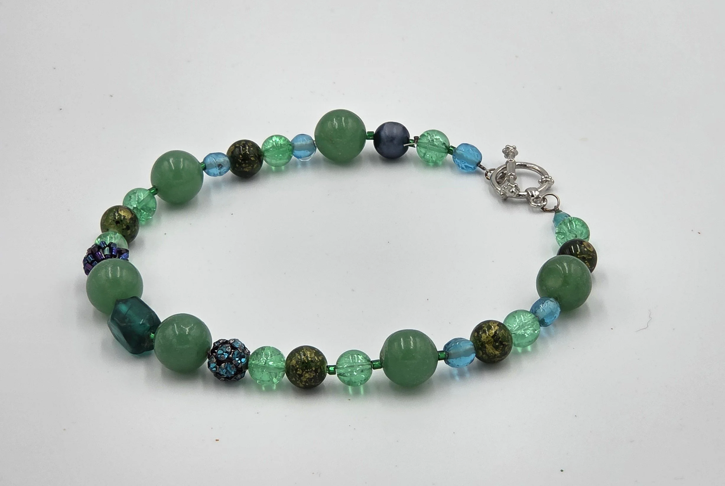 Green choker necklace with matte agate and sparkling glass beads.