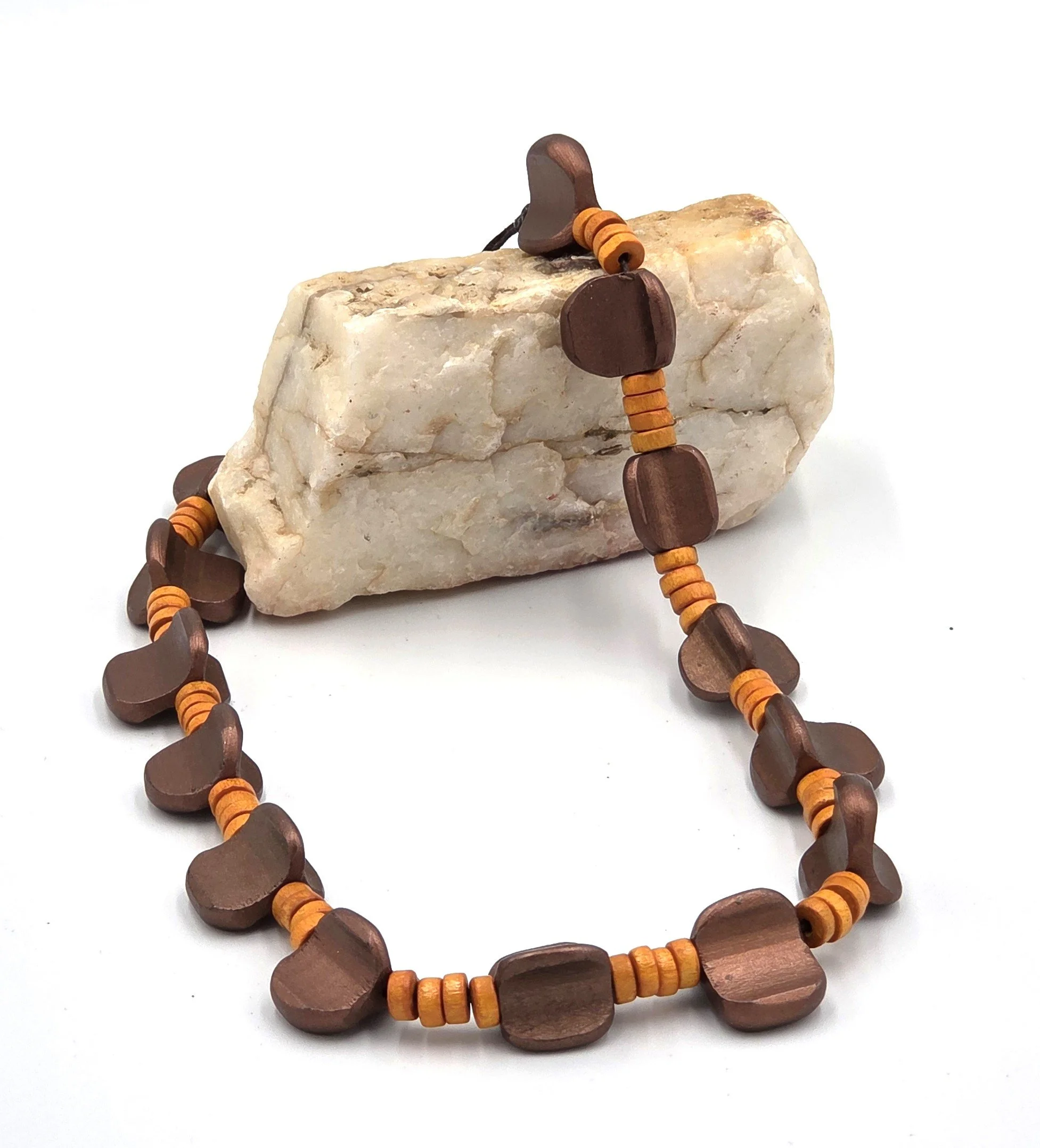 Bronze asymmetric wood beads and orange disc beads on a 48cm necklace.