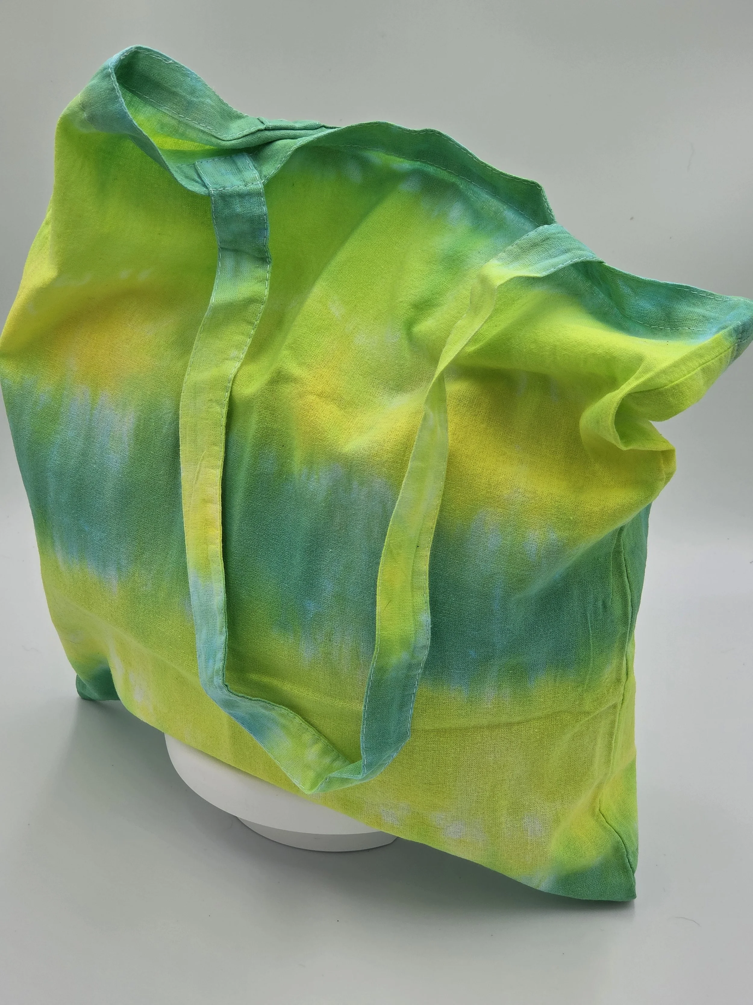 Hand-dyed cotton tote bag with horizontal lime, green, and yellow stripes. OOAK textile art handmade in Canberra by Livity Studio.