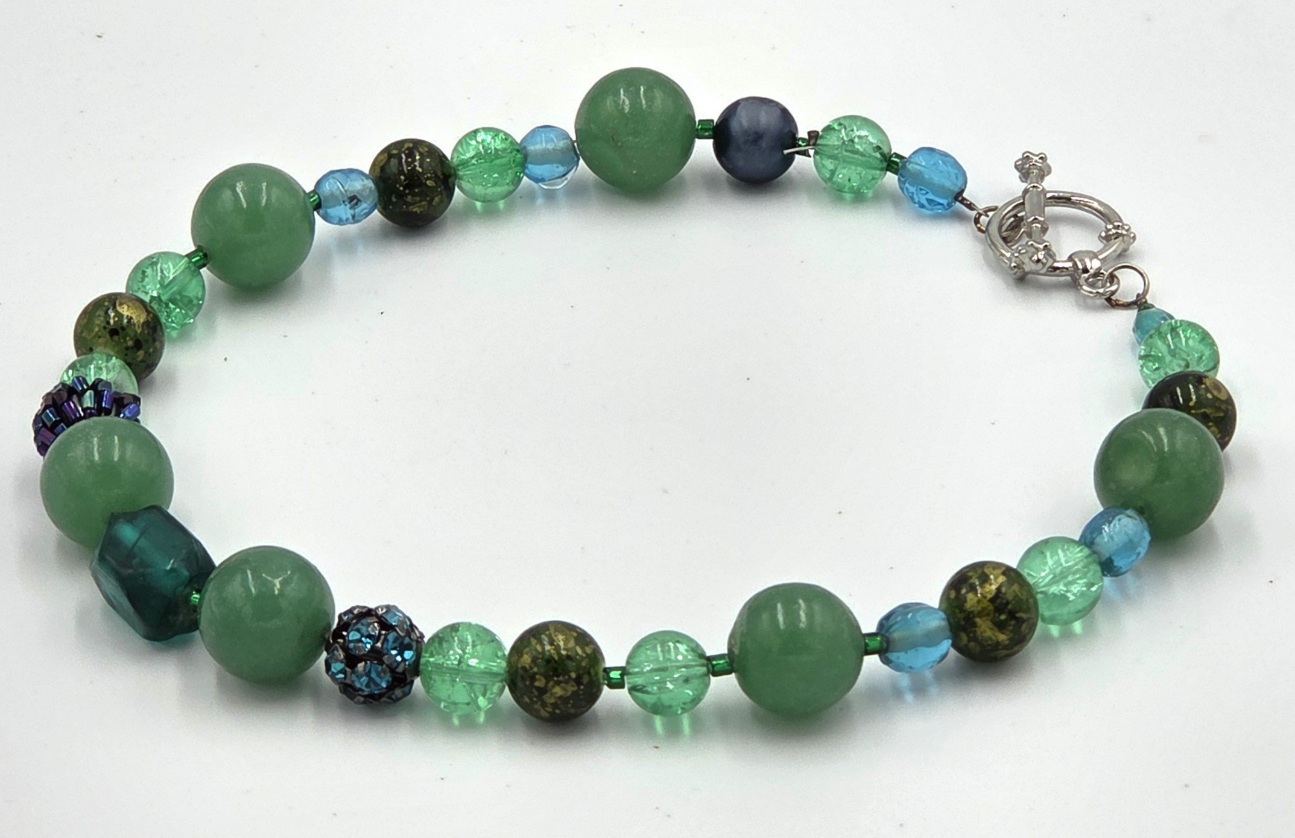 Green choker necklace with matte agate and sparkling glass beads.