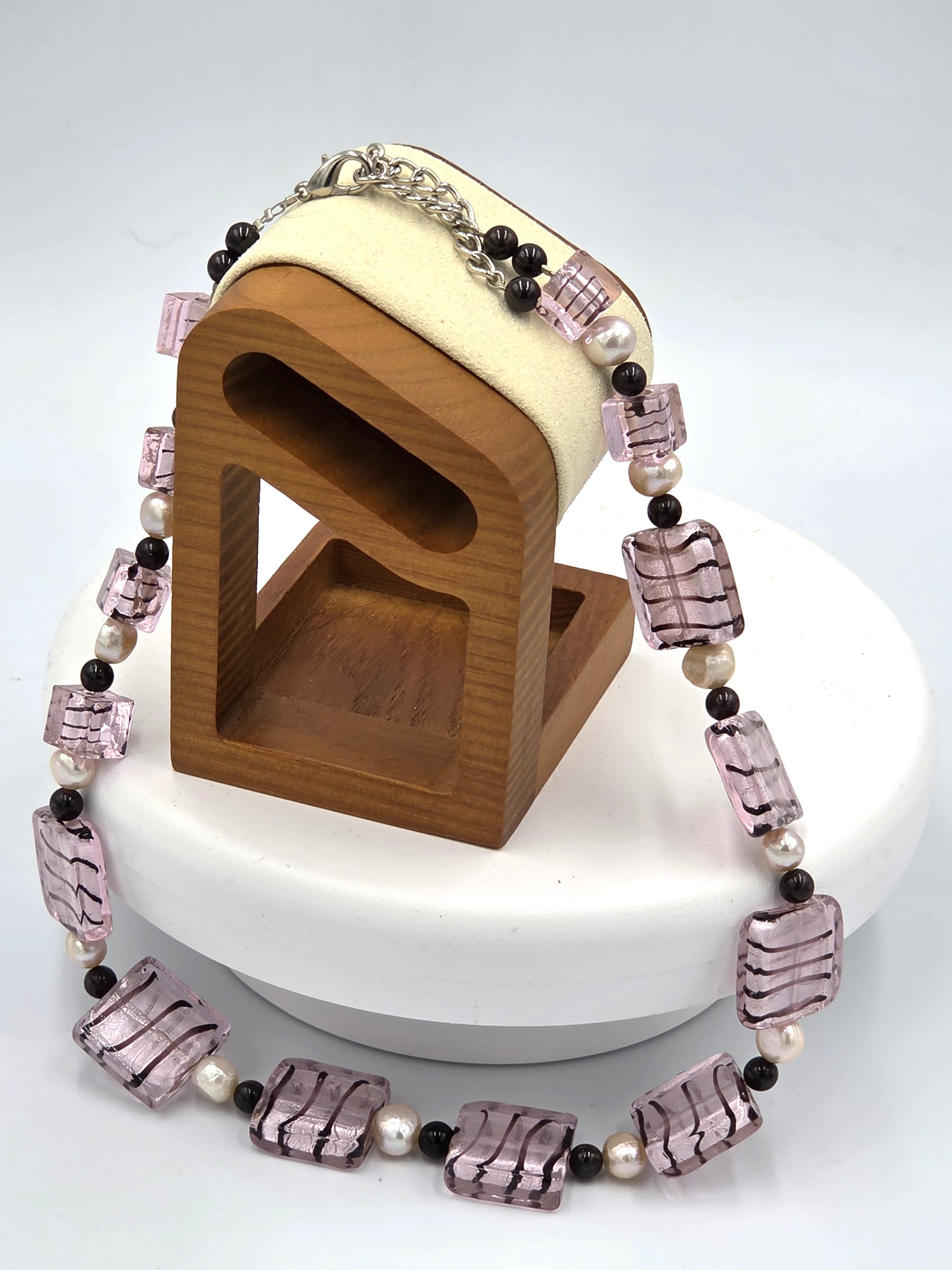 Pink and black striped silver-foil glass rectangles with pink freshwater pearls and red garnet beads on an adjustable silver clasp necklace.