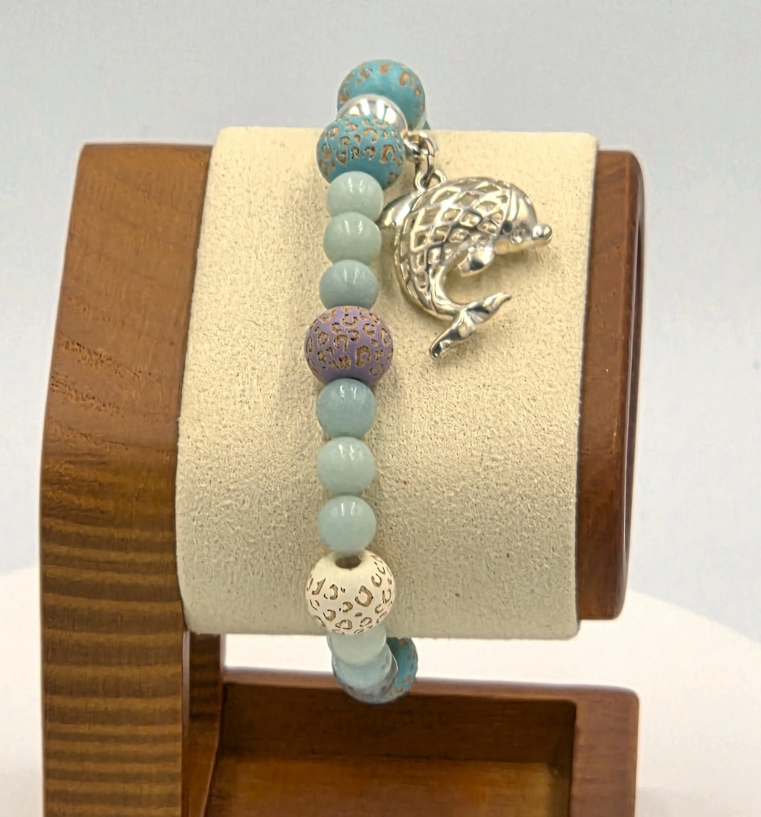 OOAK blue and mauve patterned wood and Amazonite elastic bracelet with a large silver dolphin.
