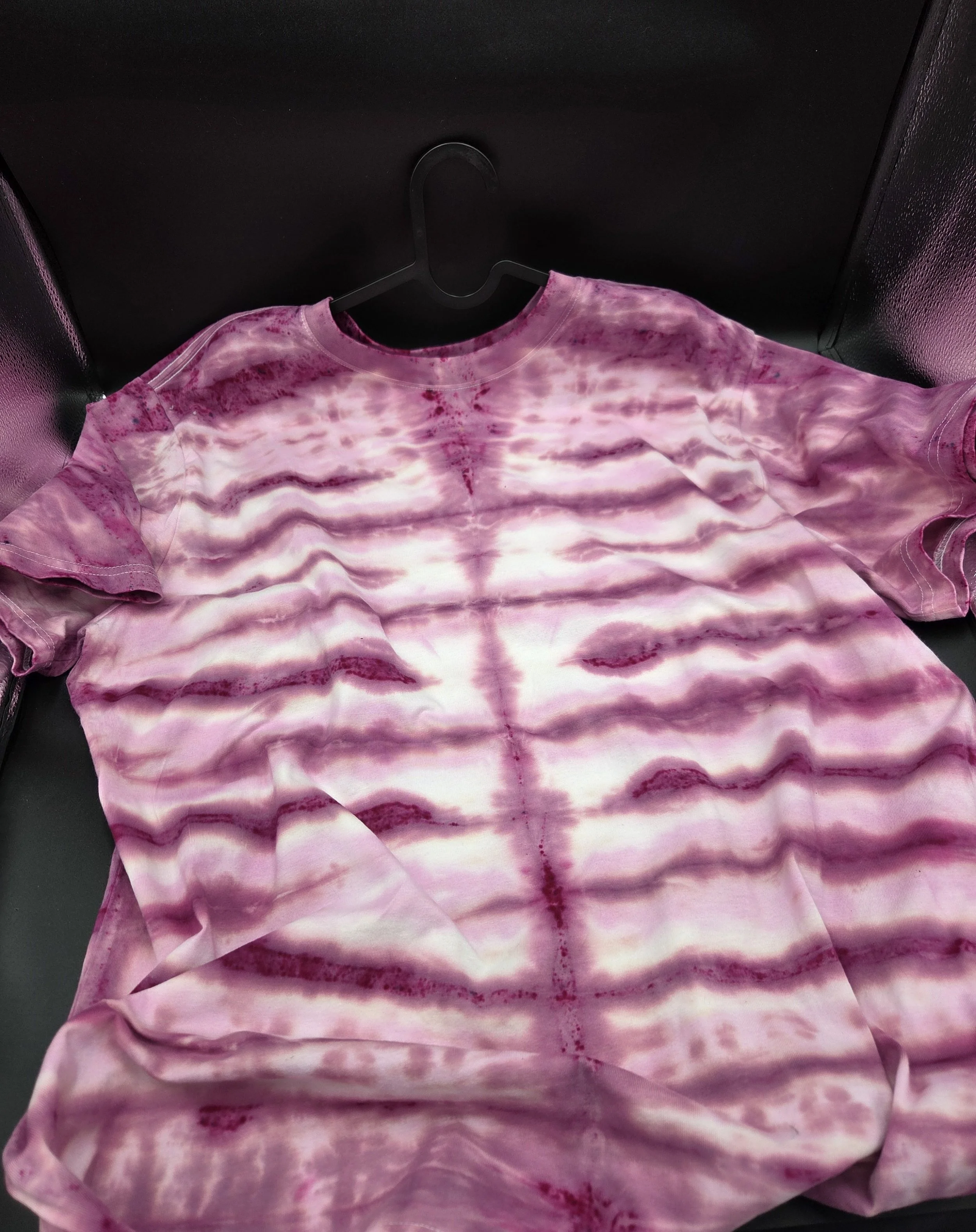 Adult XL hand-dyed 100% cotton T-shirt featuring horizontal candy stripes in shades of dark pink and dusky rose. OOAK textile art by Livity Studio Canberra.