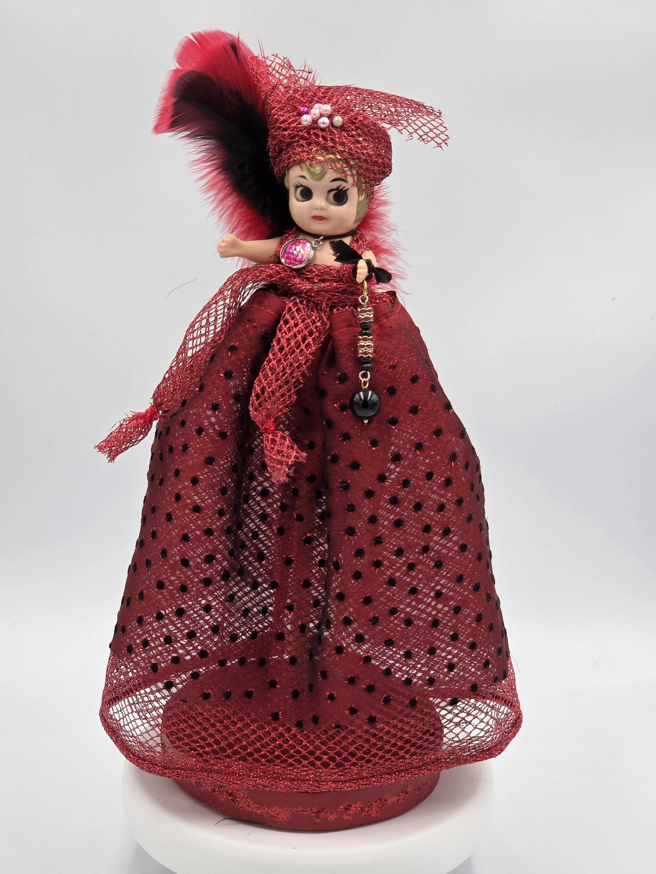 Carmen Figure: OOAK 30cm art doll in striking red and black shiny netting with a feather and pearl headdress.
