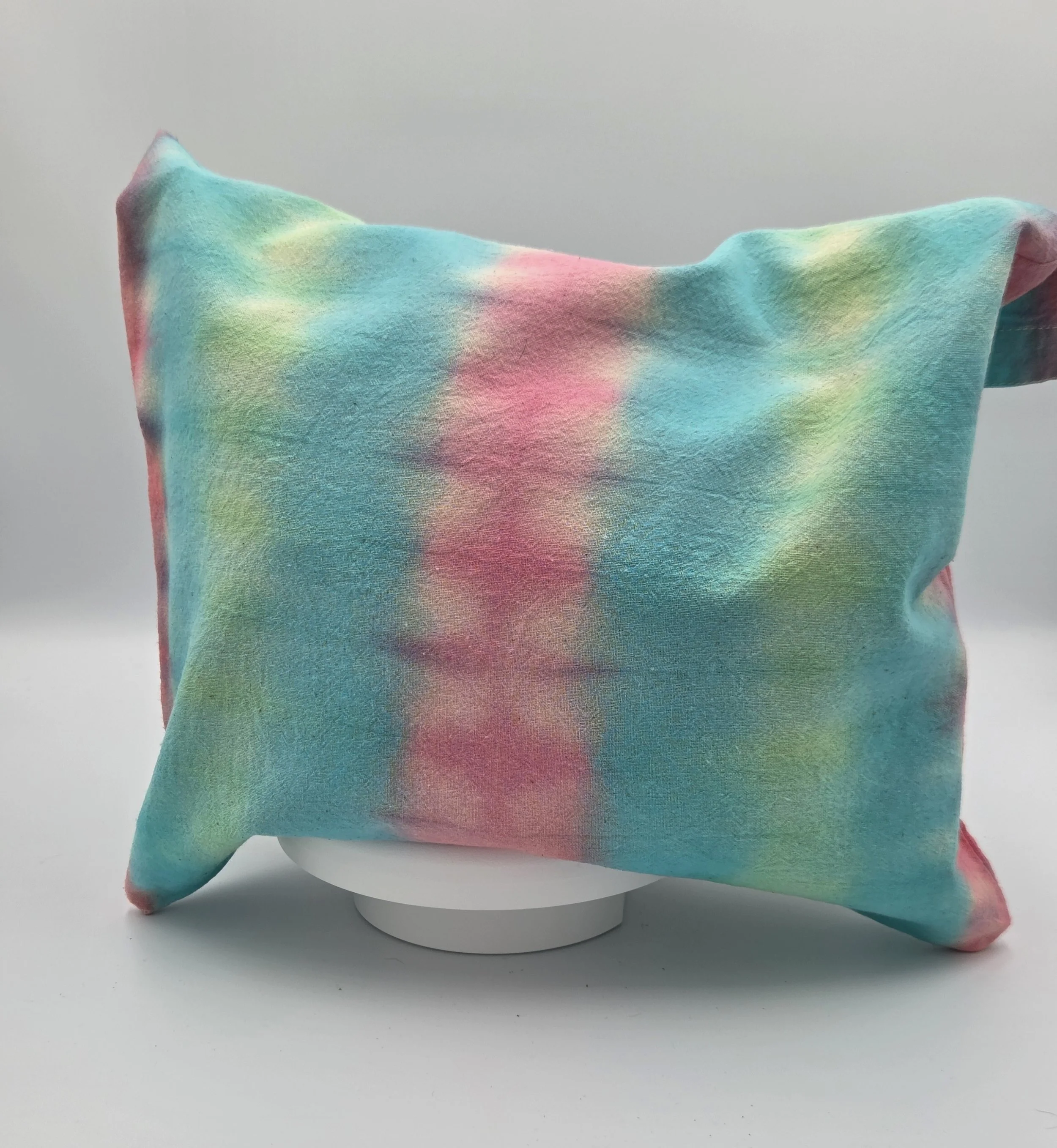 "Hand-dyed calico cotton tote bag with vertical pastel bands of bubblegum pink, teal, and lime green. One-of-a-kind textile art by Livity Studio Canberra."