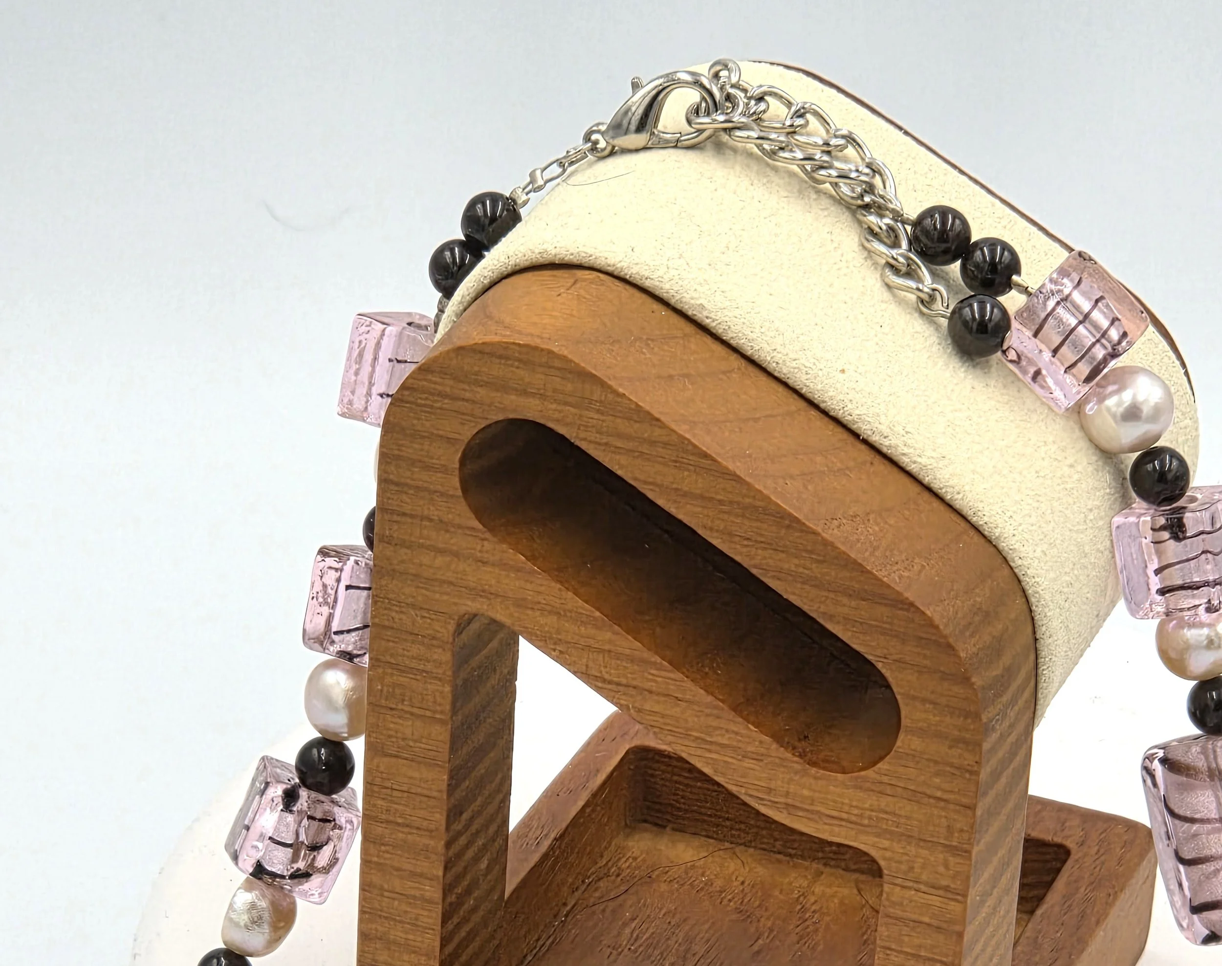 Pink and black striped silver-foil glass rectangles with pink freshwater pearls and red garnet beads on an adjustable silver clasp necklace.