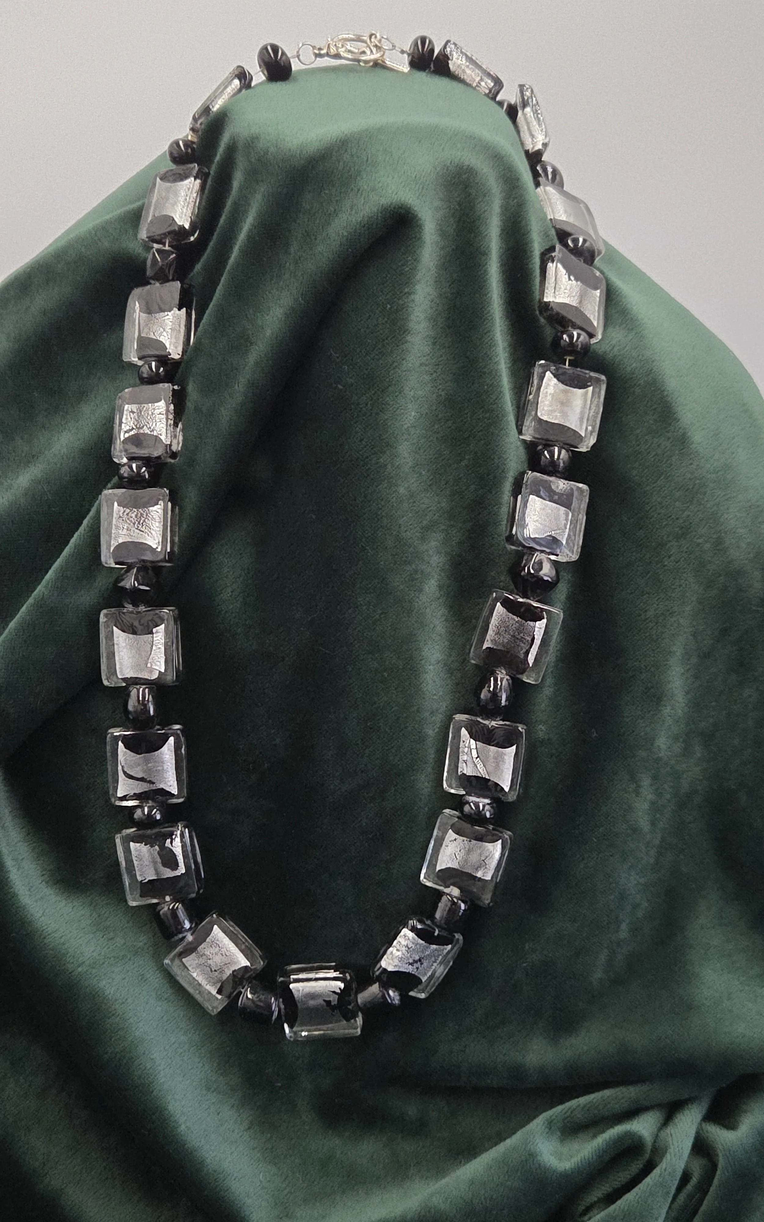 OOAK necklace with large square black lampwork glass beads and shimmering silver foil accents.