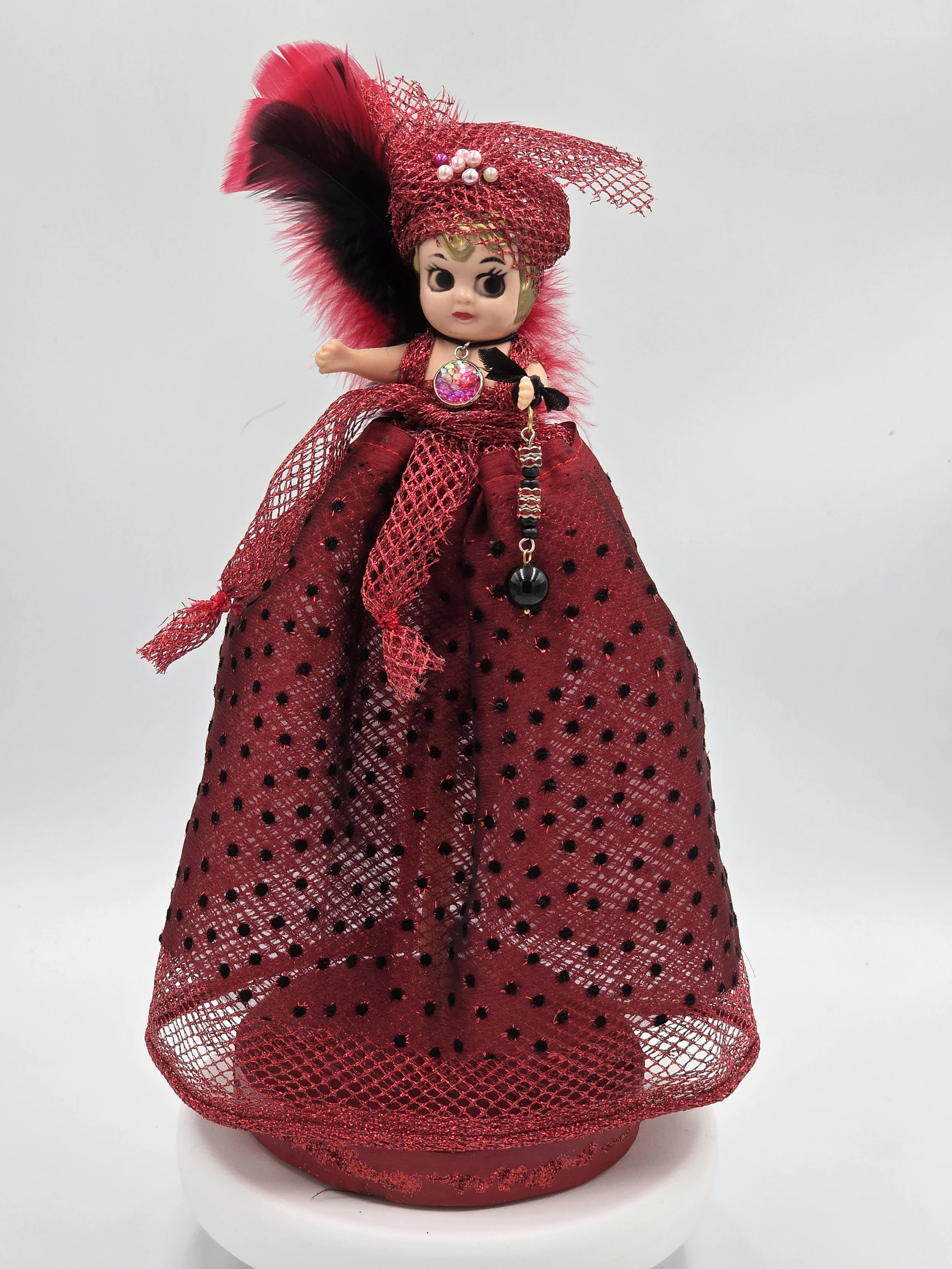 Carmen Figure: OOAK 30cm art doll in striking red and black shiny netting with a feather and pearl headdress.