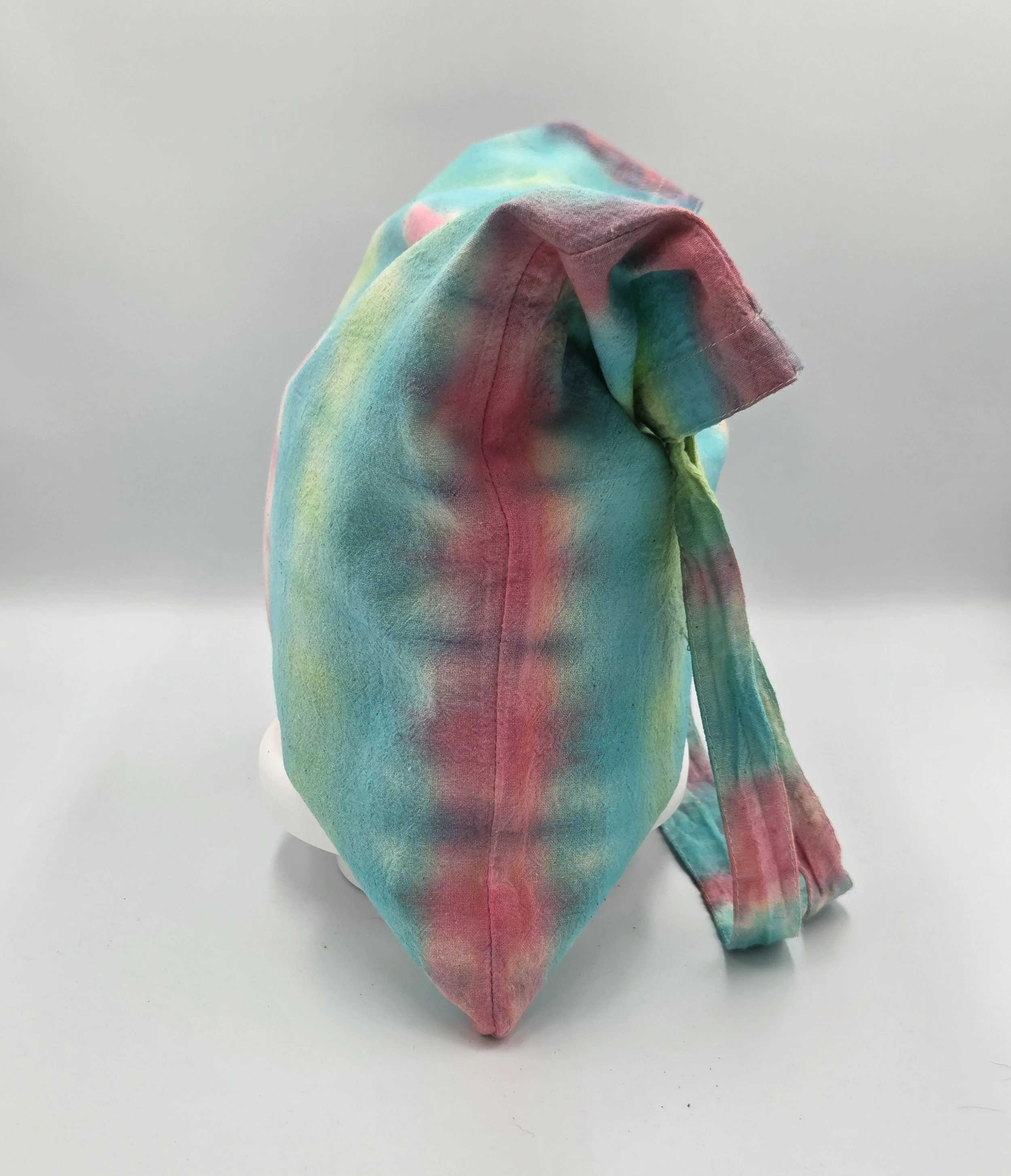 "Hand-dyed calico cotton tote bag with vertical pastel bands of bubblegum pink, teal, and lime green. One-of-a-kind textile art by Livity Studio Canberra."