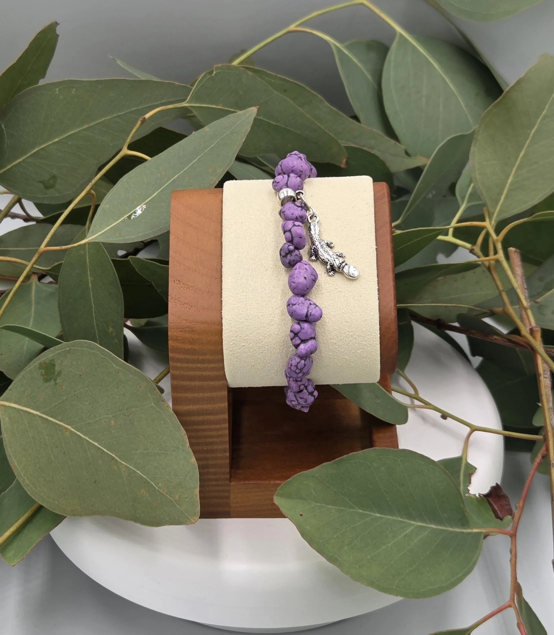 OOAK purple Howlite nugget bracelet with silver platypus charm with background of gum leaves