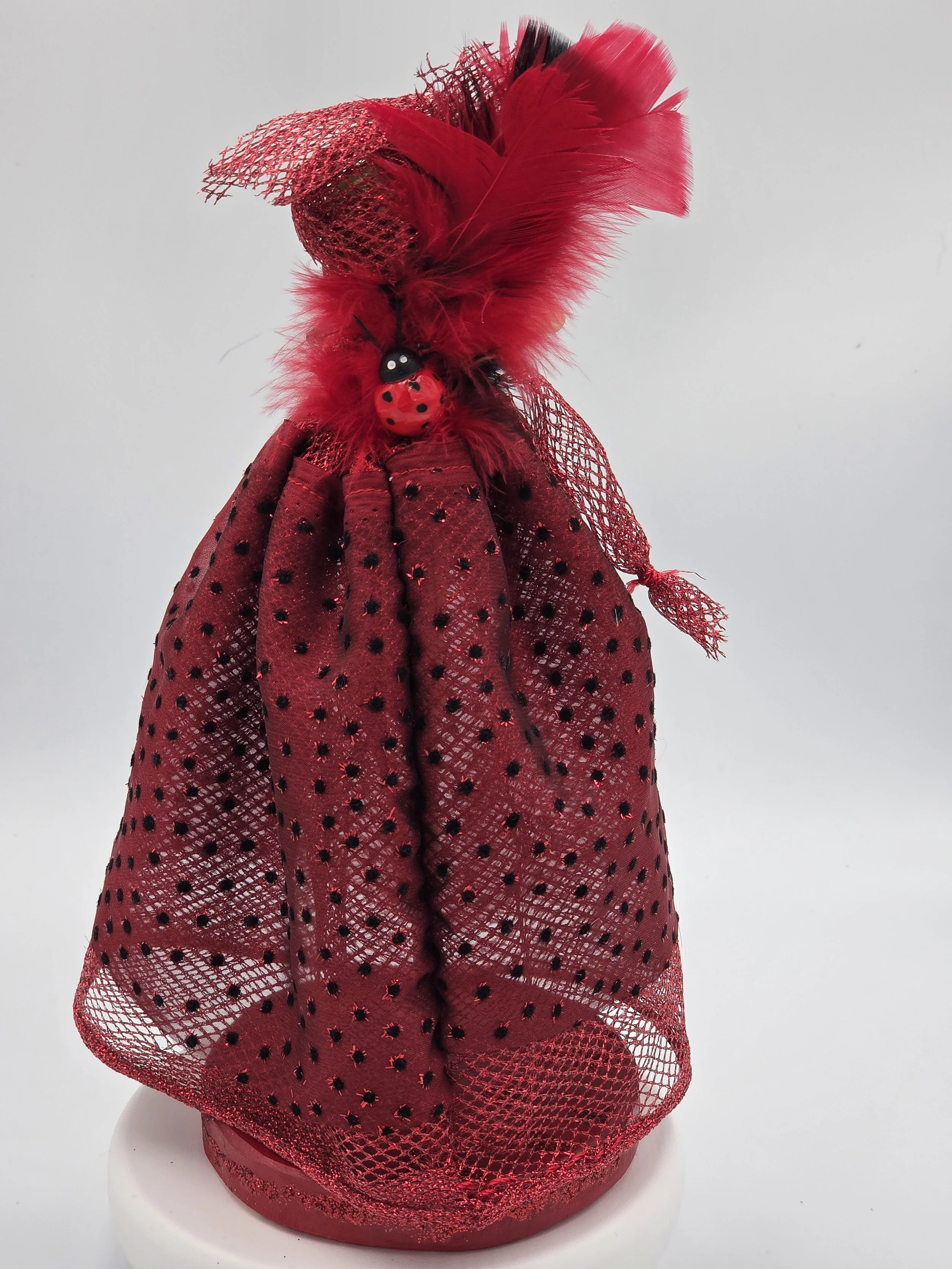 Carmen Figure: OOAK 30cm art doll in striking red and black shiny netting with a feather and pearl headdress.