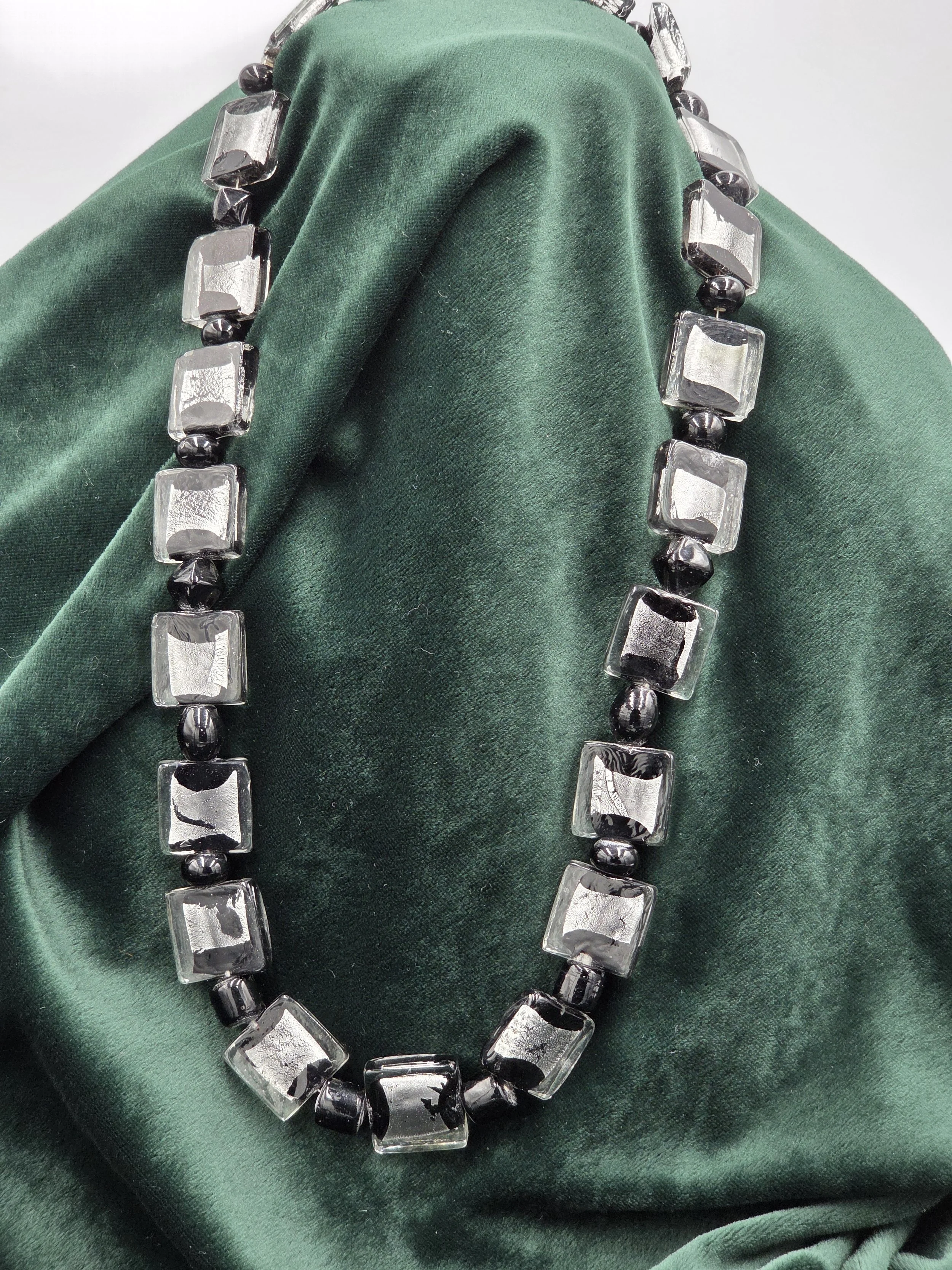 OOAK necklace with large square black lampwork glass beads and shimmering silver foil accents.